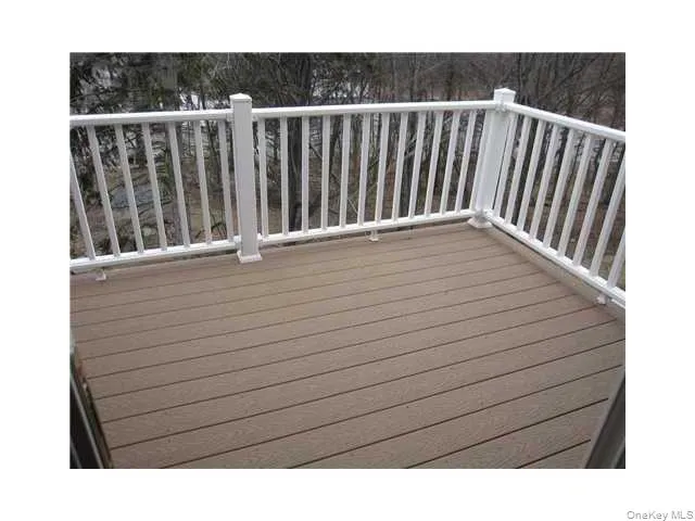 Private trex deck with access from glass sliding doors from the living room Private trex deck with access from glass sliding doors from the living room
