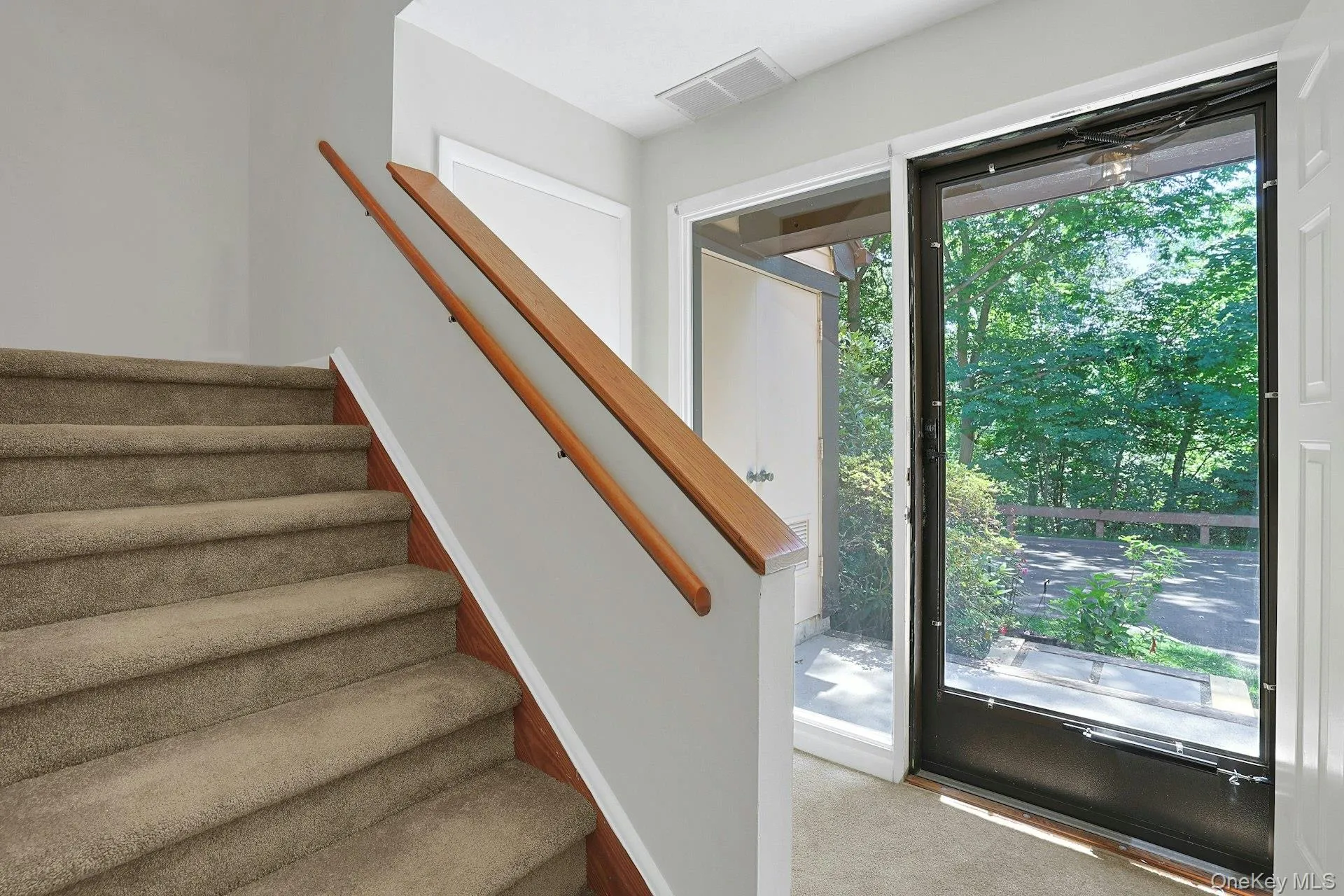 The bright main entry - on the right is the door to the attached garage, with extra storage space. On the left are two good sized closets. The bright main entry - on the right is the door to the attached garage, with extra storage space. On the left are two good sized closets.