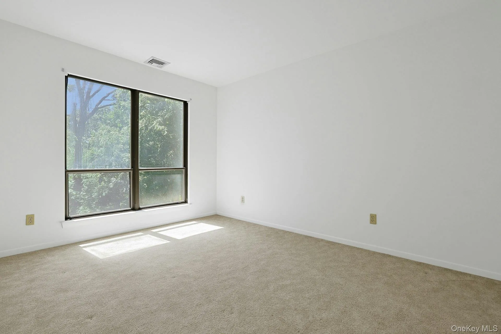 The good-sized second bedroom has the same comfortable carpeting throughout. The good-sized second bedroom has the same comfortable carpeting throughout.