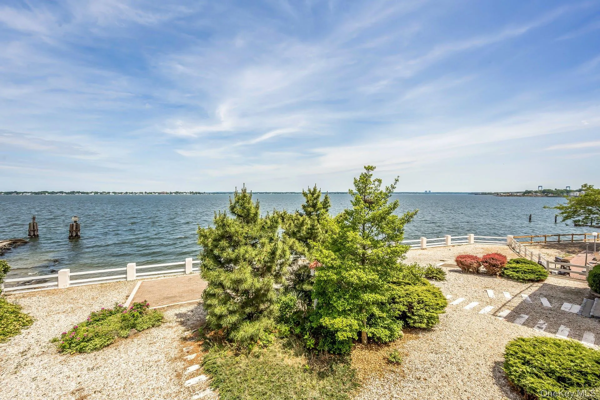 Property view of water and landscaping Property view of water and landscaping