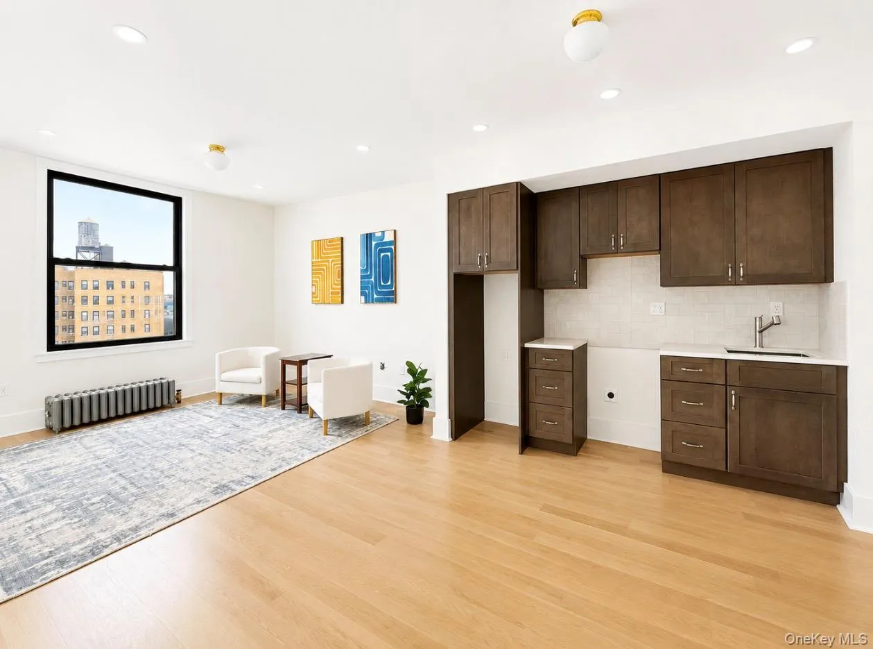 Open concept kitchen and living room. Extra wide window with water view Open concept kitchen and living room. Extra wide window with water view