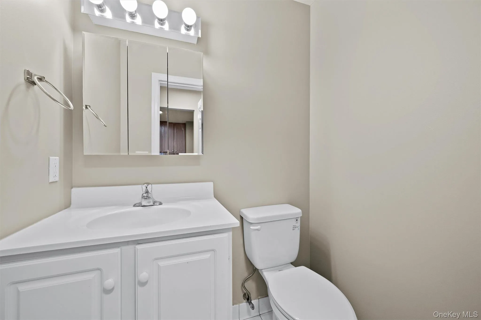 Half bath with toilet and vanity Half bath with toilet and vanity
