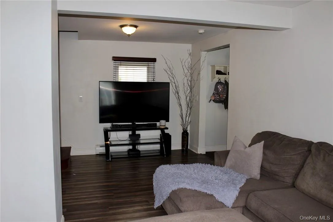 Living room with dark hardwood / wood-style floors Living room with dark hardwood / wood-style floors