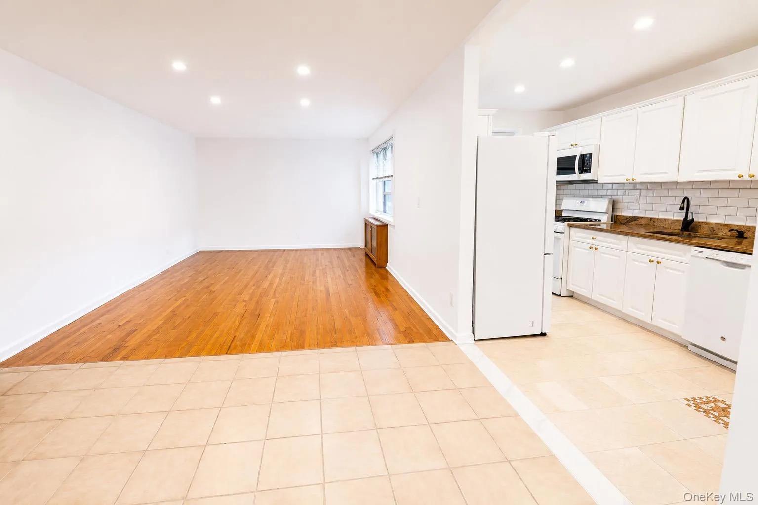Another view of this large space perfect for dining area, living room and breakfast nook. Another view of this large space perfect for dining area, living room and breakfast nook.