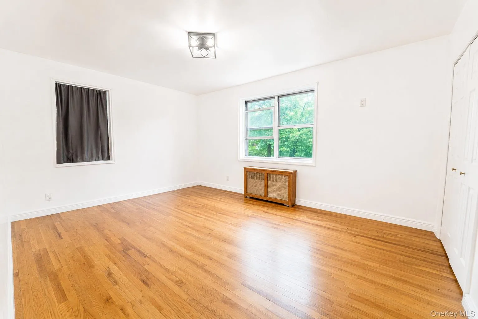 The comfortable secondary bedroom features double windows that fill the space with abundant natural light. The comfortable secondary bedroom features double windows that fill the space with abundant natural light.