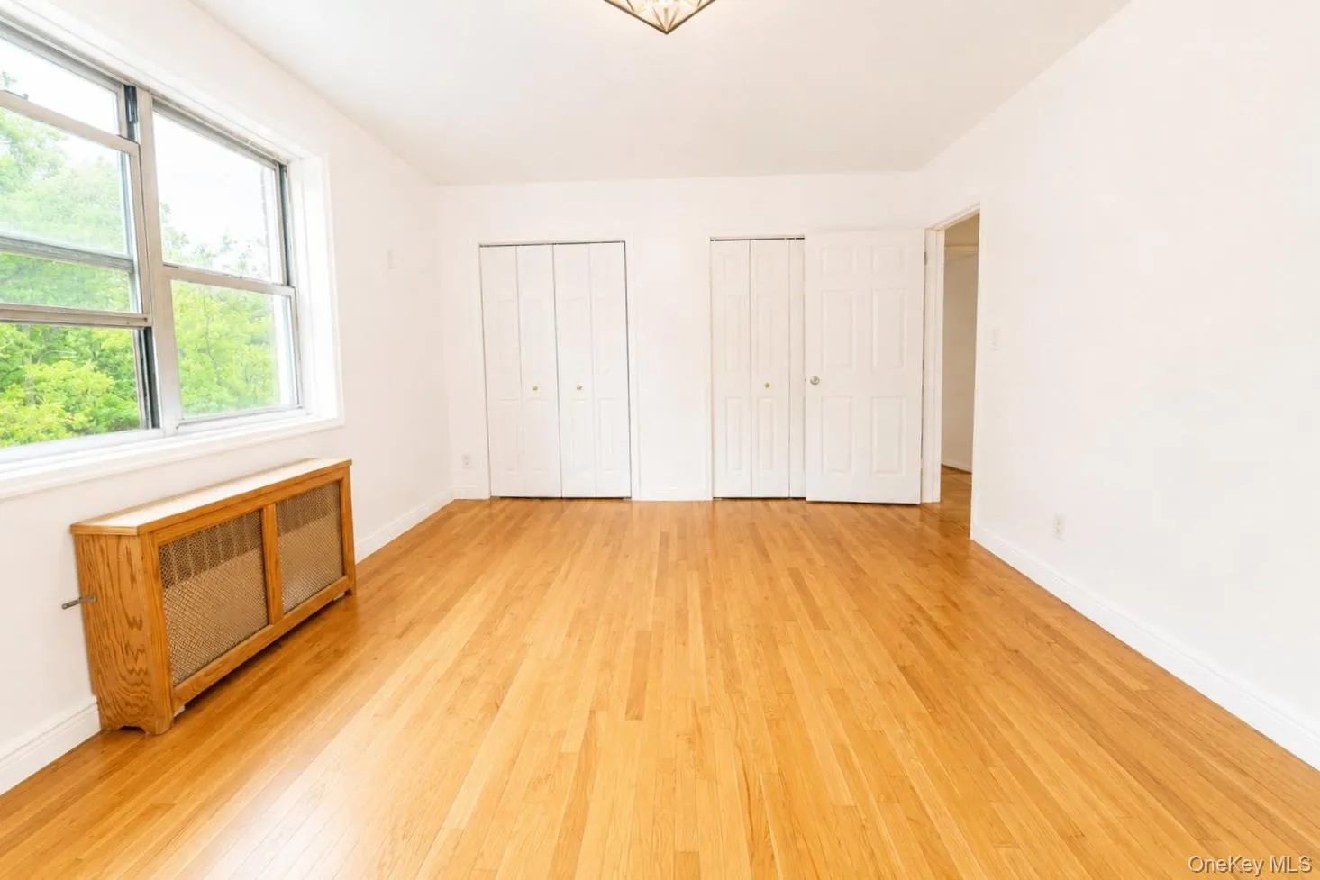 The secondary bedroom features double closets, providing ample storage space and convenience. The secondary bedroom features double closets, providing ample storage space and convenience.