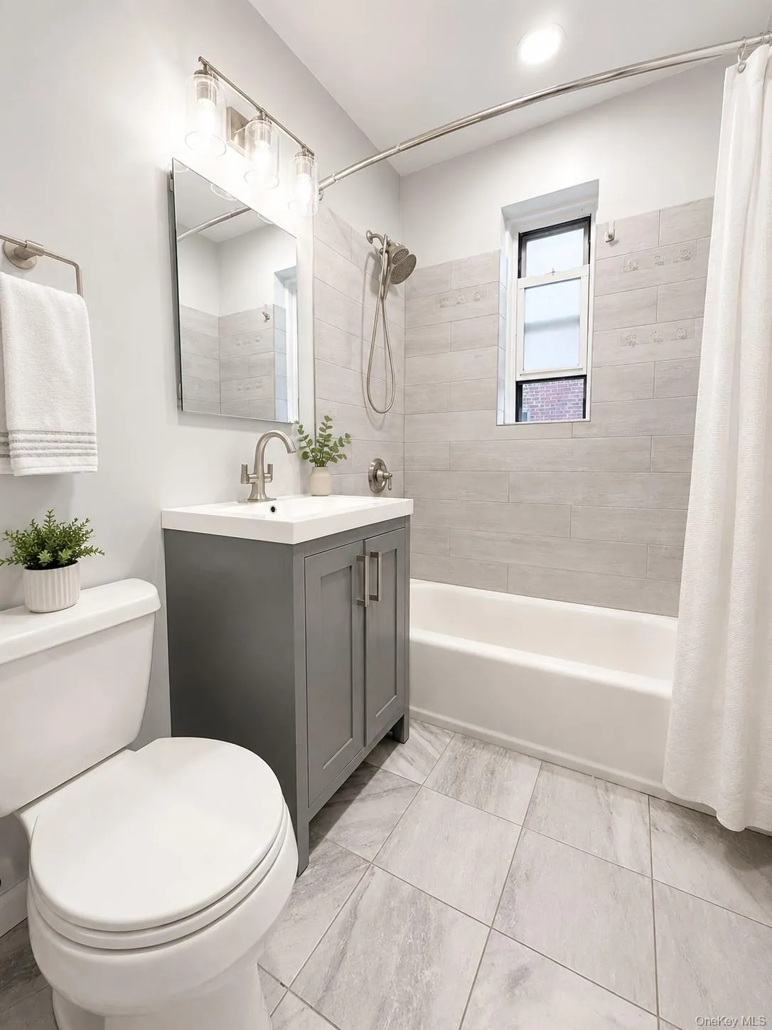 Updated bath with gorgeous tiles and tub. Updated bath with gorgeous tiles and tub.