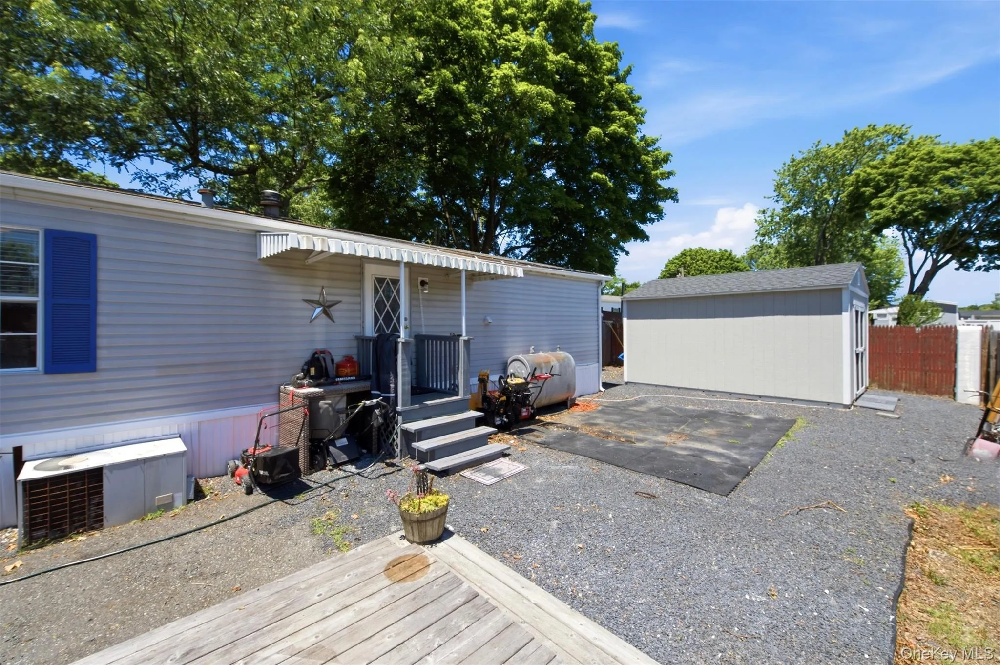 Side Yard Facing East Corner Lot-Three Sheds Side Yard Facing East Corner Lot-Three Sheds