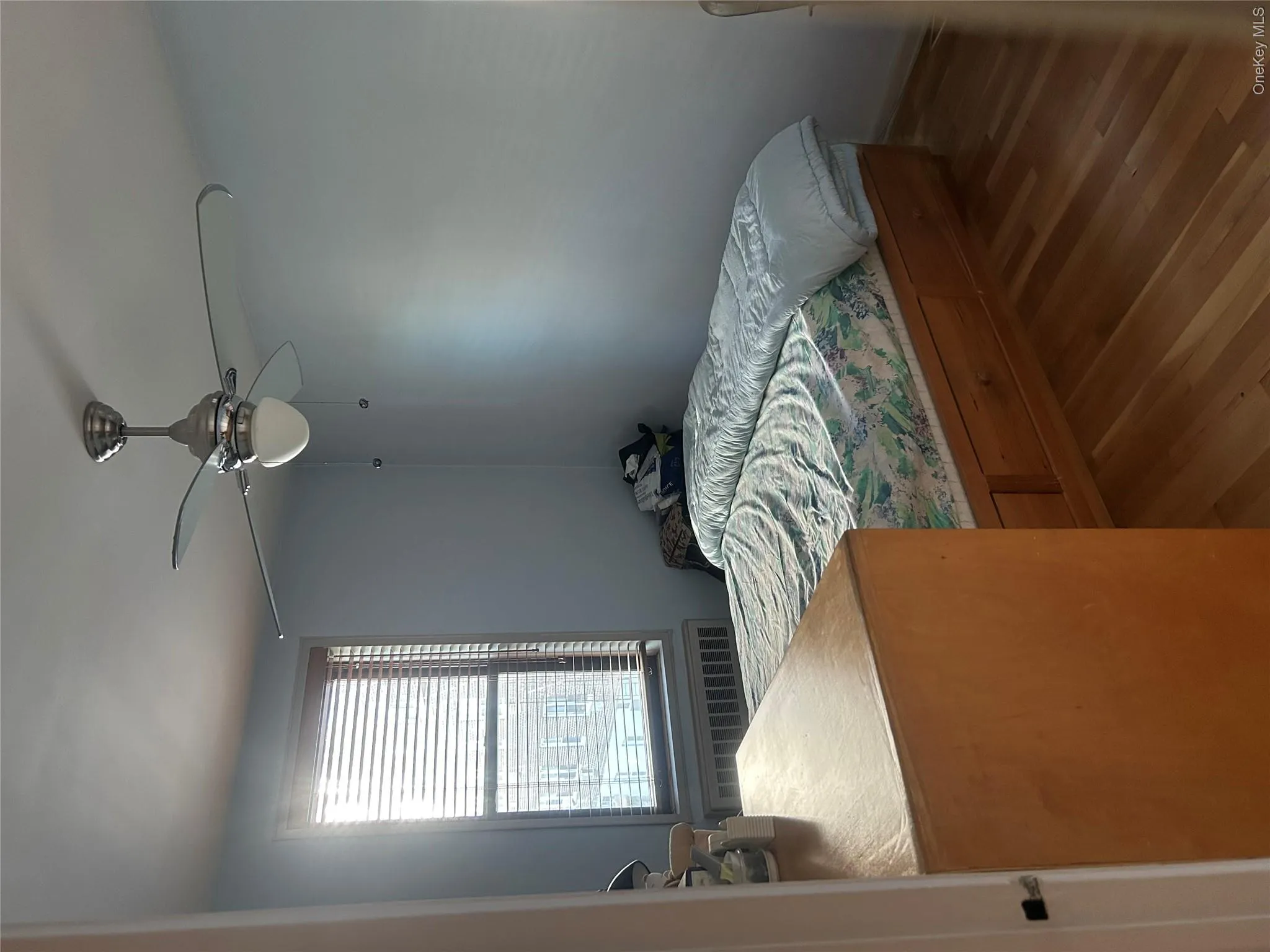 Second bedroom with windows facing east and south Second bedroom with windows facing east and south