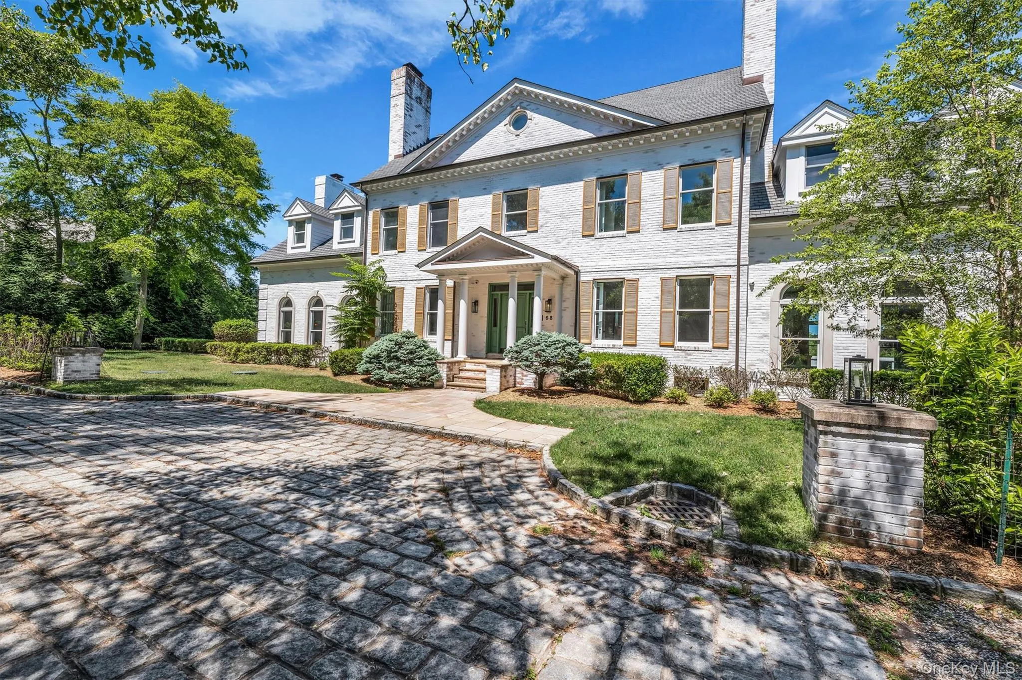 Stately white brick exterior Stately white brick exterior