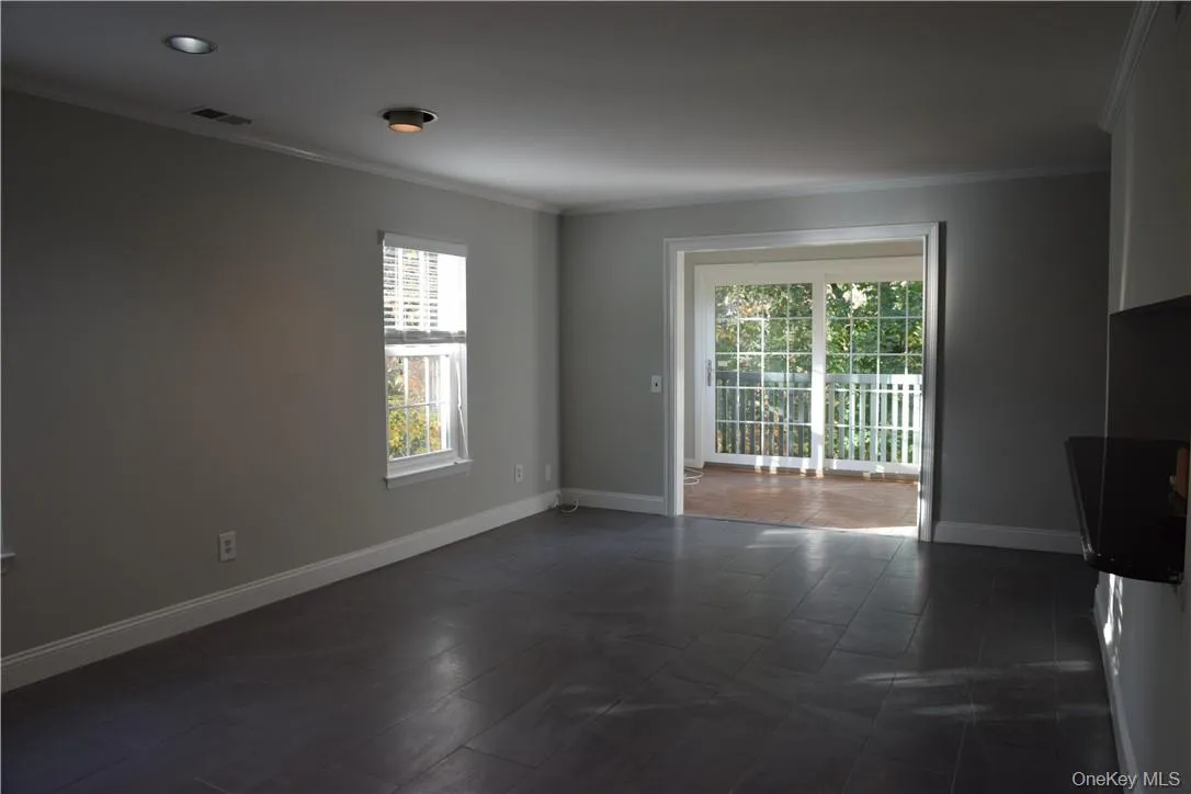 View of enclosed Sunroom from Living Room. View of enclosed Sunroom from Living Room.
