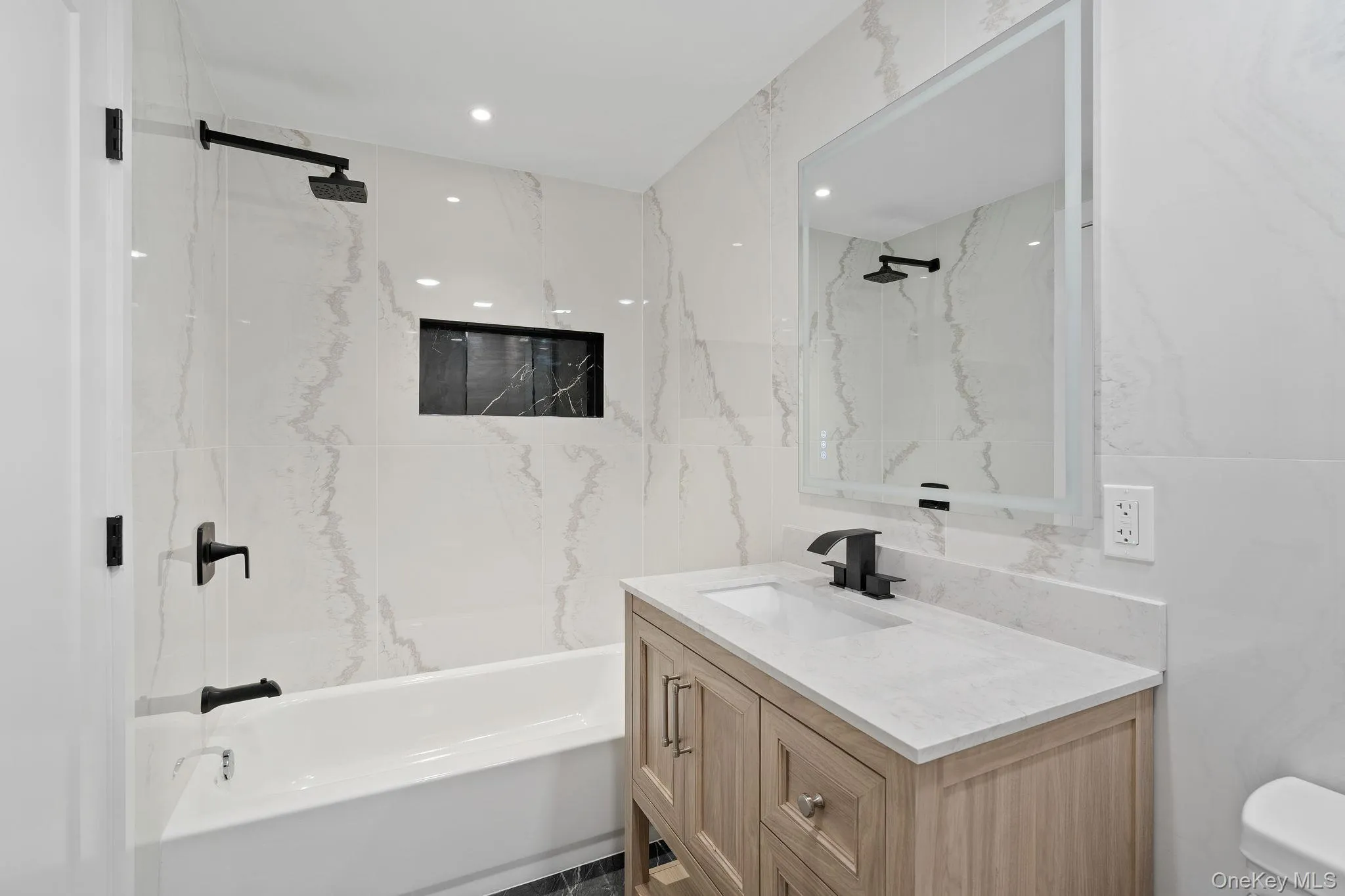 Bathroom featuring shower combination and vanity Bathroom featuring shower combination and vanity