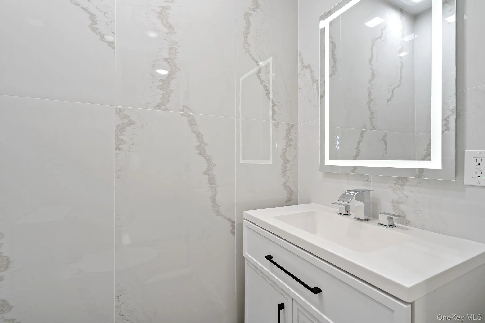 Bathroom featuring vanity Bathroom featuring vanity