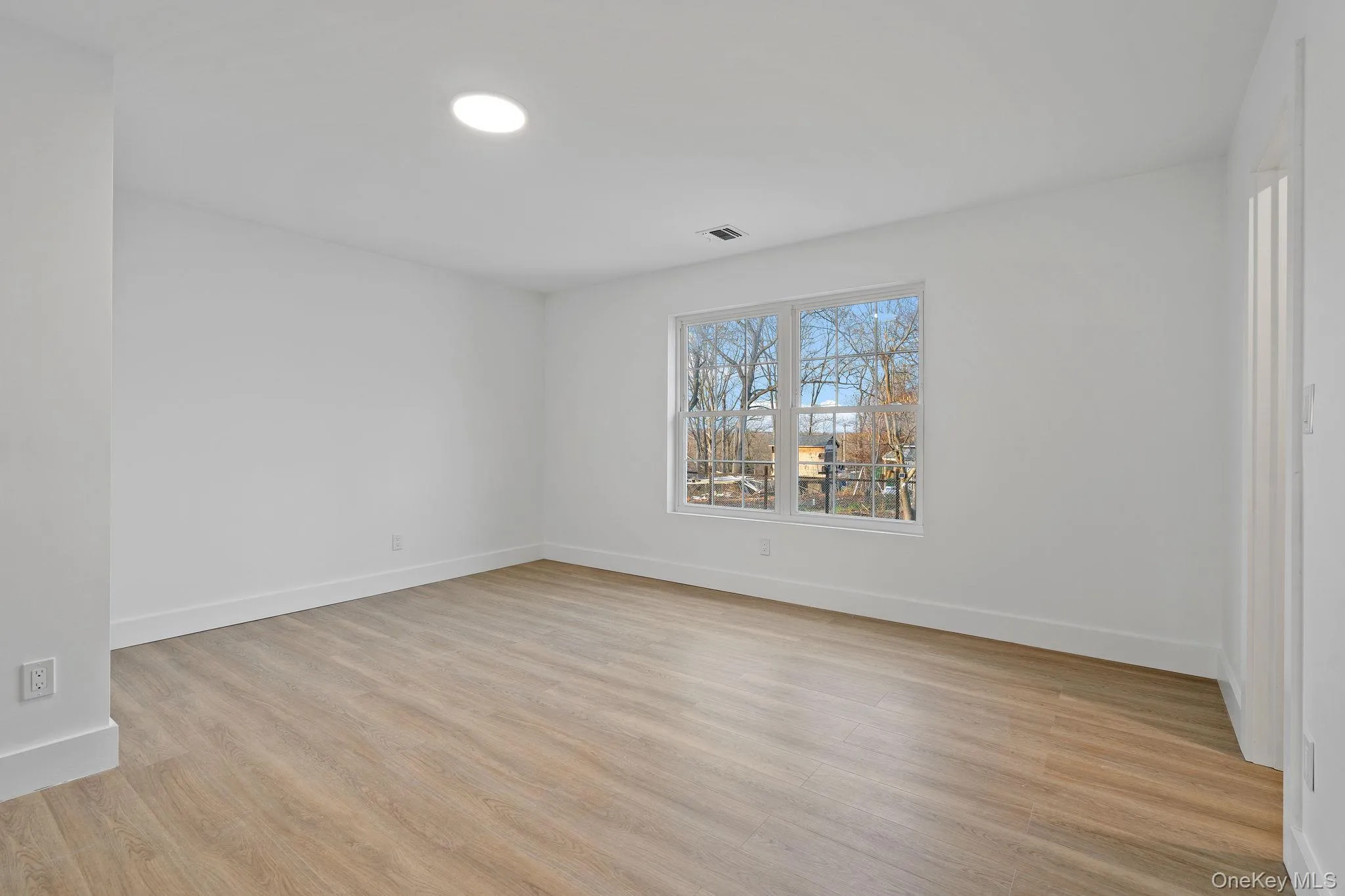 Empty room featuring light wood-type flooring Empty room featuring light wood-type flooring