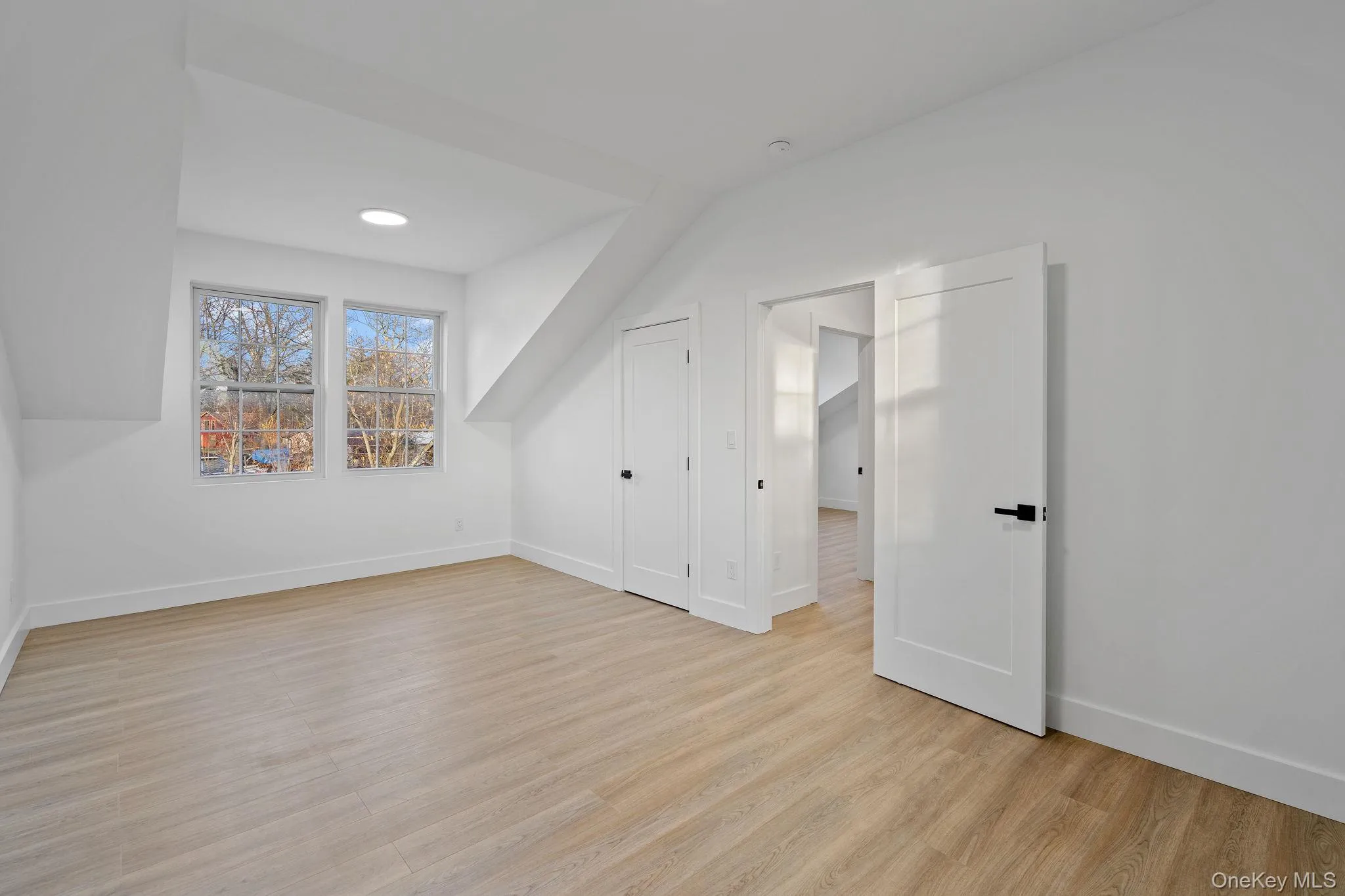 Additional living space featuring light wood-type flooring and recessed lighting Additional living space featuring light wood-type flooring and recessed lighting