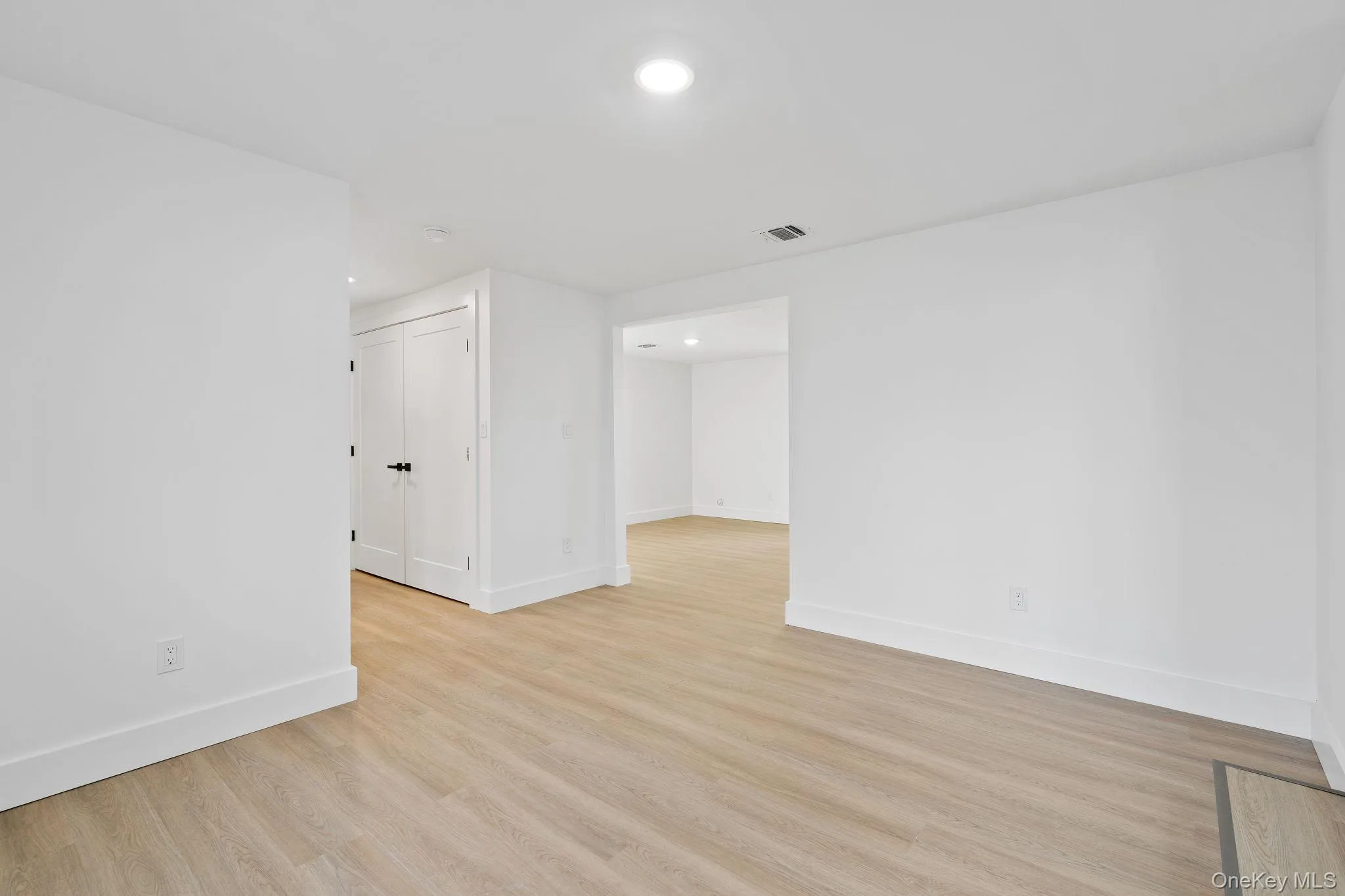 Empty room featuring recessed lighting and light wood-style flooring Empty room featuring recessed lighting and light wood-style flooring