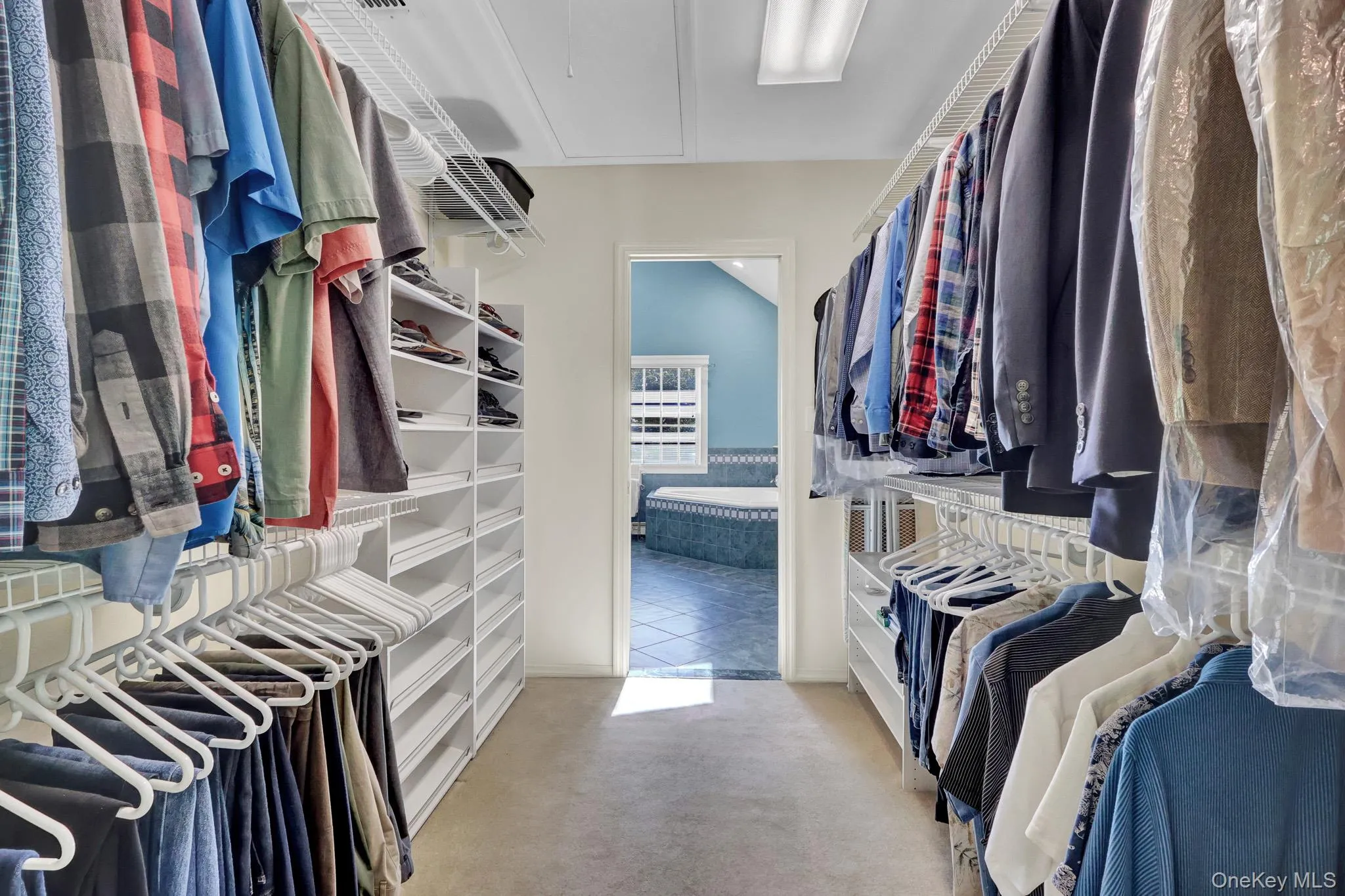 primary walk-in closet with access to bath primary walk-in closet with access to bath