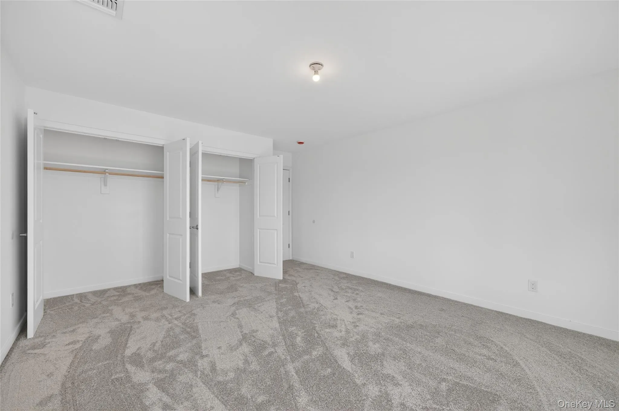 Bedroom number 4 with the closed door and beautiful spacious closets. Bedroom number 4 with the closed door and beautiful spacious closets.