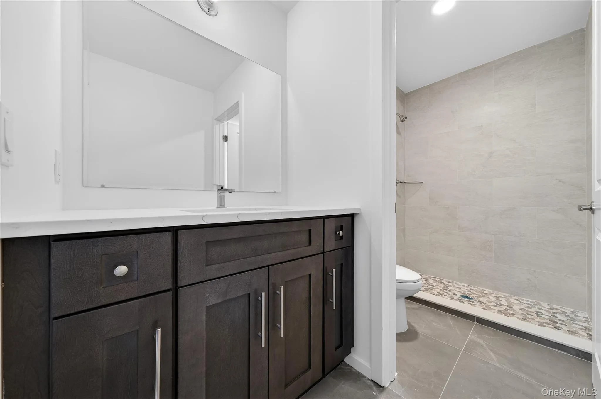 Combined view of the primary bathroom and primary vanity. Combined view of the primary bathroom and primary vanity.