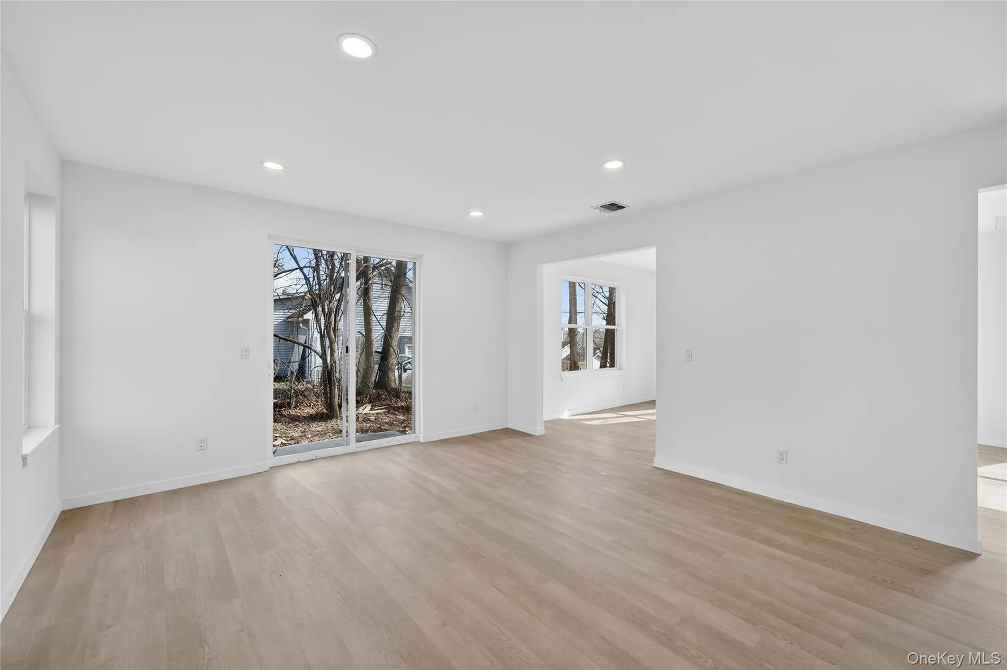 Beautiful and spacious dining area with a view into the living room. Beautiful and spacious dining area with a view into the living room.