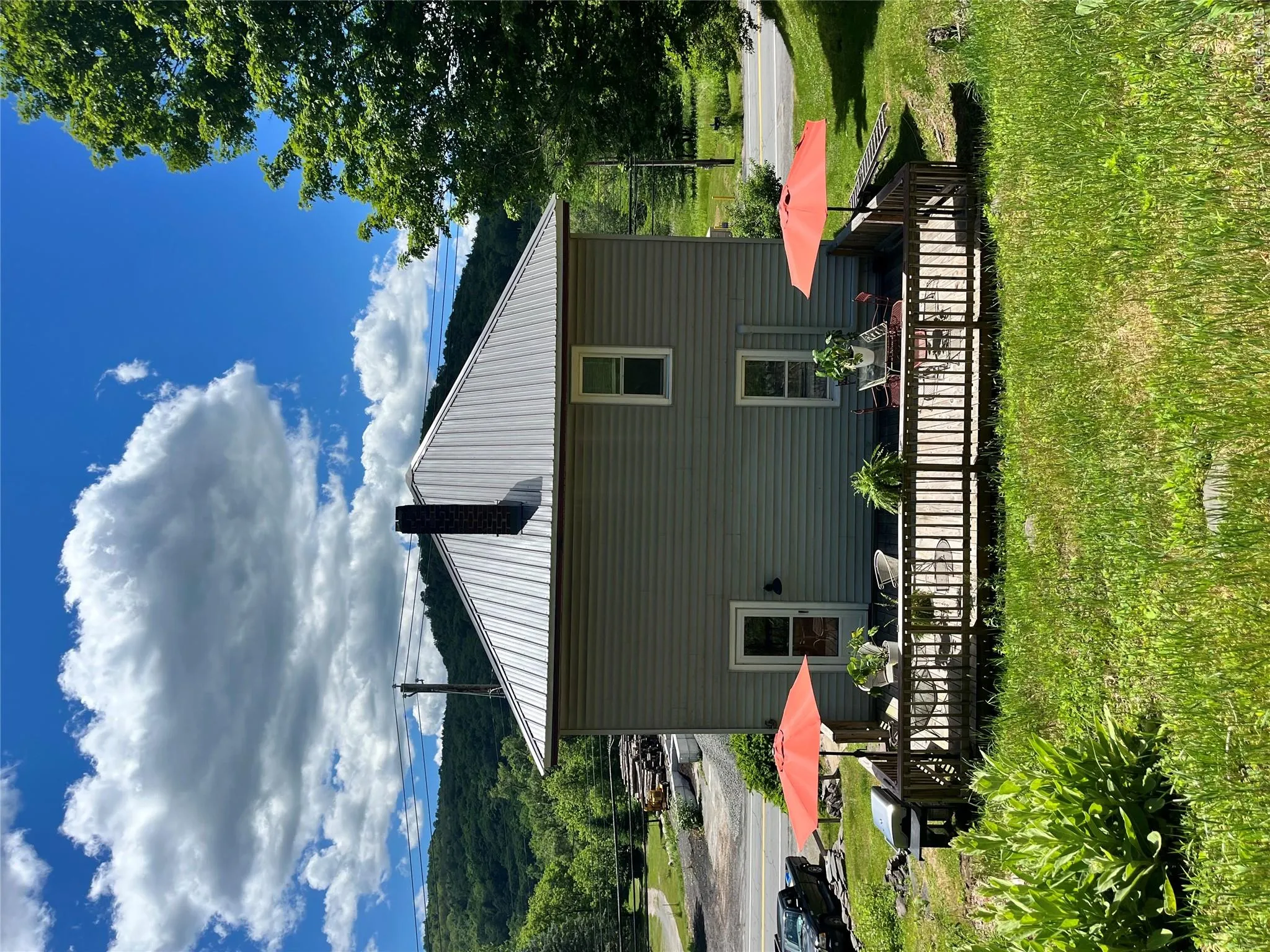 View of the back of structure from up on hillside behind the home View of the back of structure from up on hillside behind the home