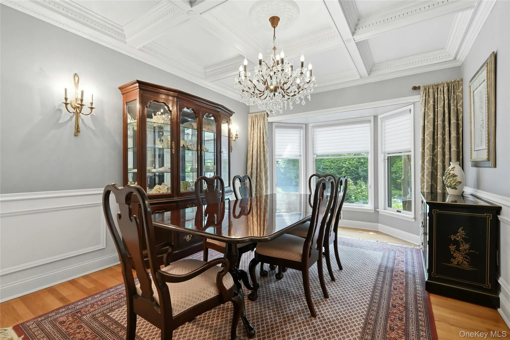 The Gracious, Banquet Formal Dining Room Offers Breathtaking Coffered Ceilings, Beautiful Box Paneled/Wainscoted Walls, 9' Ceilings With A Large (& Extra Height) Bay Window For An Abundance Of Natural Light (Overlooks The Backyard), Chandelier, Hardwood Floors, Ample Room For A Good Sized Dining Room Table & Chairs, China Cabinet/Hutch & Additional Server/Console, And The Formal Dining Room Opens Into The Kitchen. The Gracious, Banquet Formal Dining Room Offers Breathtaking Coffered Ceilings, Beautiful Box Paneled/Wainscoted Walls, 9' Ceilings With A Large (& Extra Height) Bay Window For An Abundance Of Natural Light (Overlooks The Backyard), Chandelier, Hardwood Floors, Ample Room For A Good Sized Dining Room Table & Chairs, China Cabinet/Hutch & Additional Server/Console, And The Formal Dining Room Opens Into The Kitchen.