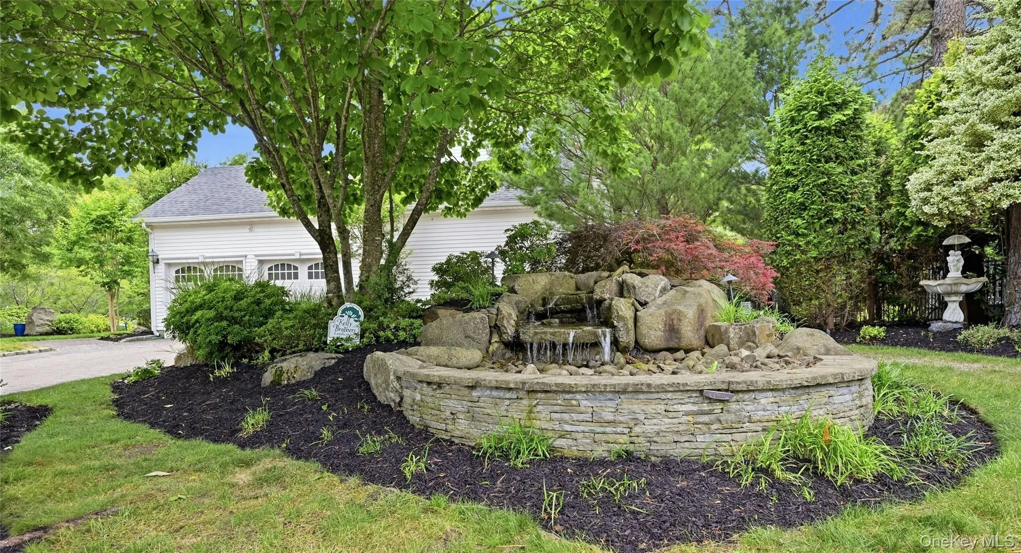 Another View Of The Stunning, Meticulously Landscaped Property Which Is Wrapped In Stone Walls, Rocks, Boulders, Paver Stones & Also Offers A Spectacular Custom Stone And Boulder Waterfall On The Side Of The Property Another View Of The Stunning, Meticulously Landscaped Property Which Is Wrapped In Stone Walls, Rocks, Boulders, Paver Stones & Also Offers A Spectacular Custom Stone And Boulder Waterfall On The Side Of The Property
