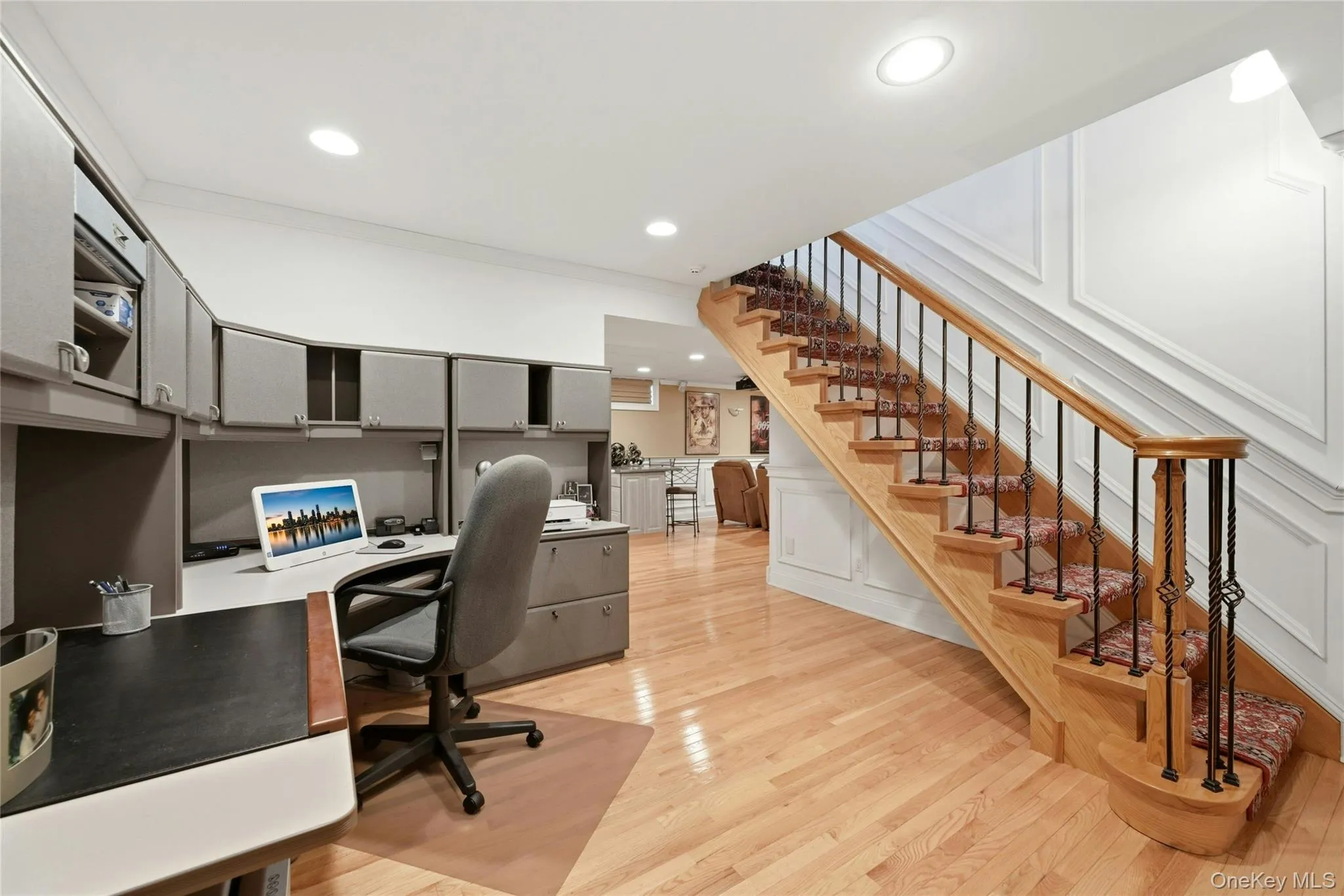 The Stunning Open Stairway Also Leads To The Lower Level Which Begins With A Perfect Home Office Offering Lots Of Space For A Desk And File/Storage Cabinetry, Has Stunning Box Paneled/Wainscoted Walls, Beautiful Hardwood Floors, Recessed Lighting, And Opens Into The Spectacular Media Room & Recreation Space. The Stunning Open Stairway Also Leads To The Lower Level Which Begins With A Perfect Home Office Offering Lots Of Space For A Desk And File/Storage Cabinetry, Has Stunning Box Paneled/Wainscoted Walls, Beautiful Hardwood Floors, Recessed Lighting, And Opens Into The Spectacular Media Room & Recreation Space.