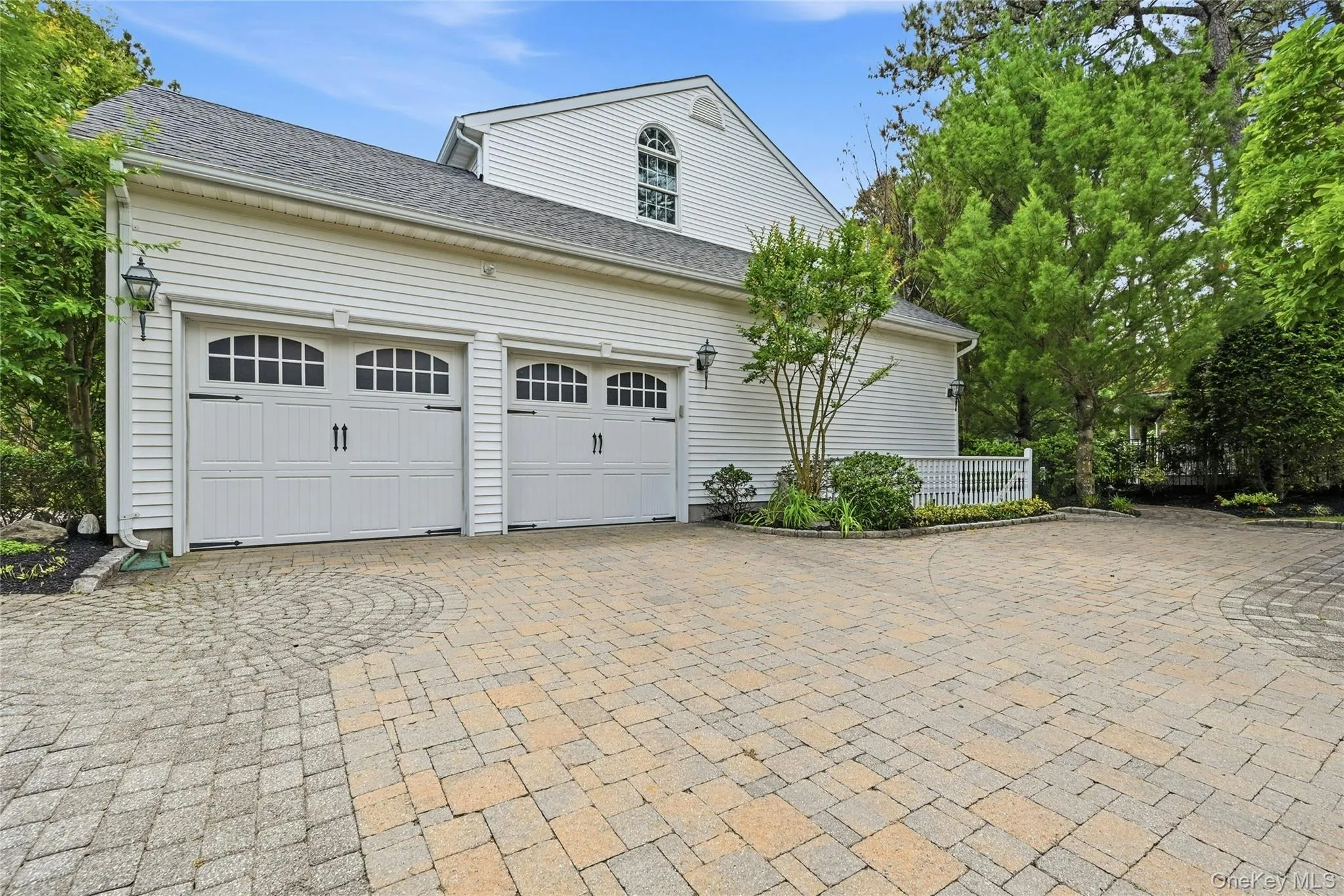 The Side Of The Home Offers Access To The Two Car Garage With A Second Oversized Belgium Block Lined Fully Paver Stone Driveway With Additional Side Parking Area, Beautiful Inlays And Decorative Borders, An Outside Entrance To The Basement And Access To The Backyard. The Side Of The Home Offers Access To The Two Car Garage With A Second Oversized Belgium Block Lined Fully Paver Stone Driveway With Additional Side Parking Area, Beautiful Inlays And Decorative Borders, An Outside Entrance To The Basement And Access To The Backyard.