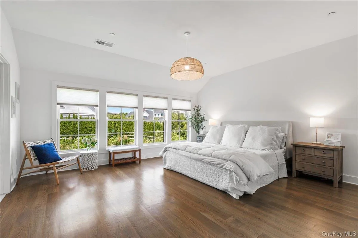 Light filled, wood floor, spacious primary bedroom w/En-Suite and custom fitted closet Light filled, wood floor, spacious primary bedroom w/En-Suite and custom fitted closet