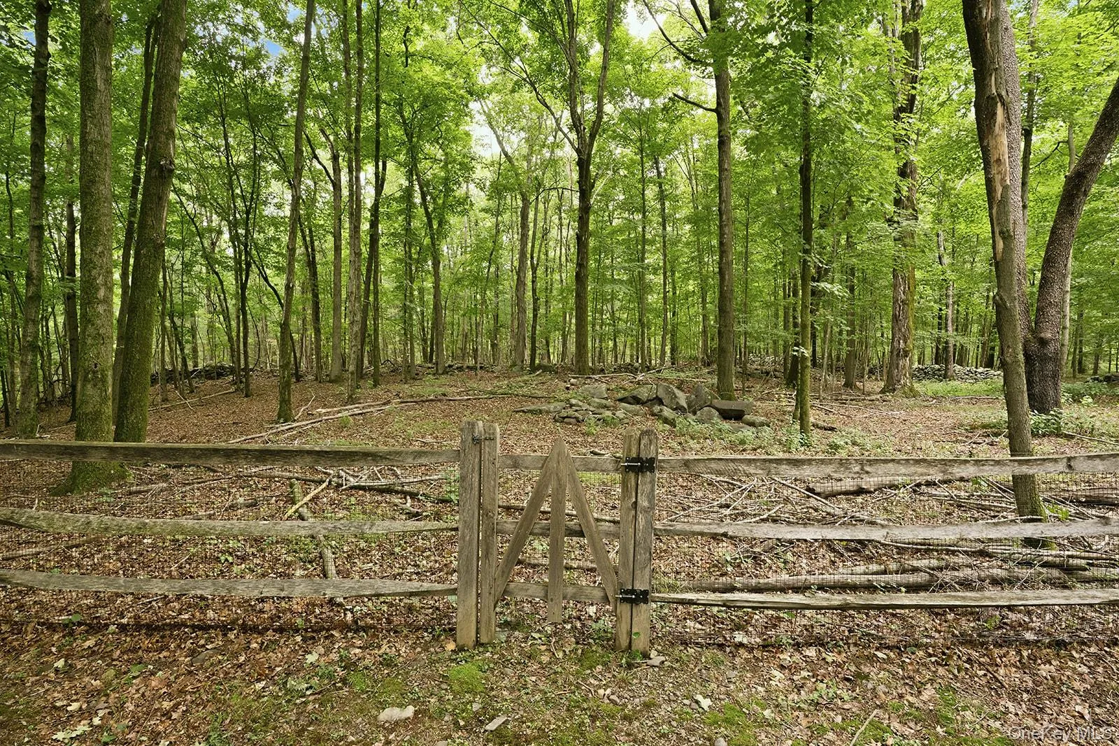 Post and beam fence is screened to enclose pets and children Post and beam fence is screened to enclose pets and children