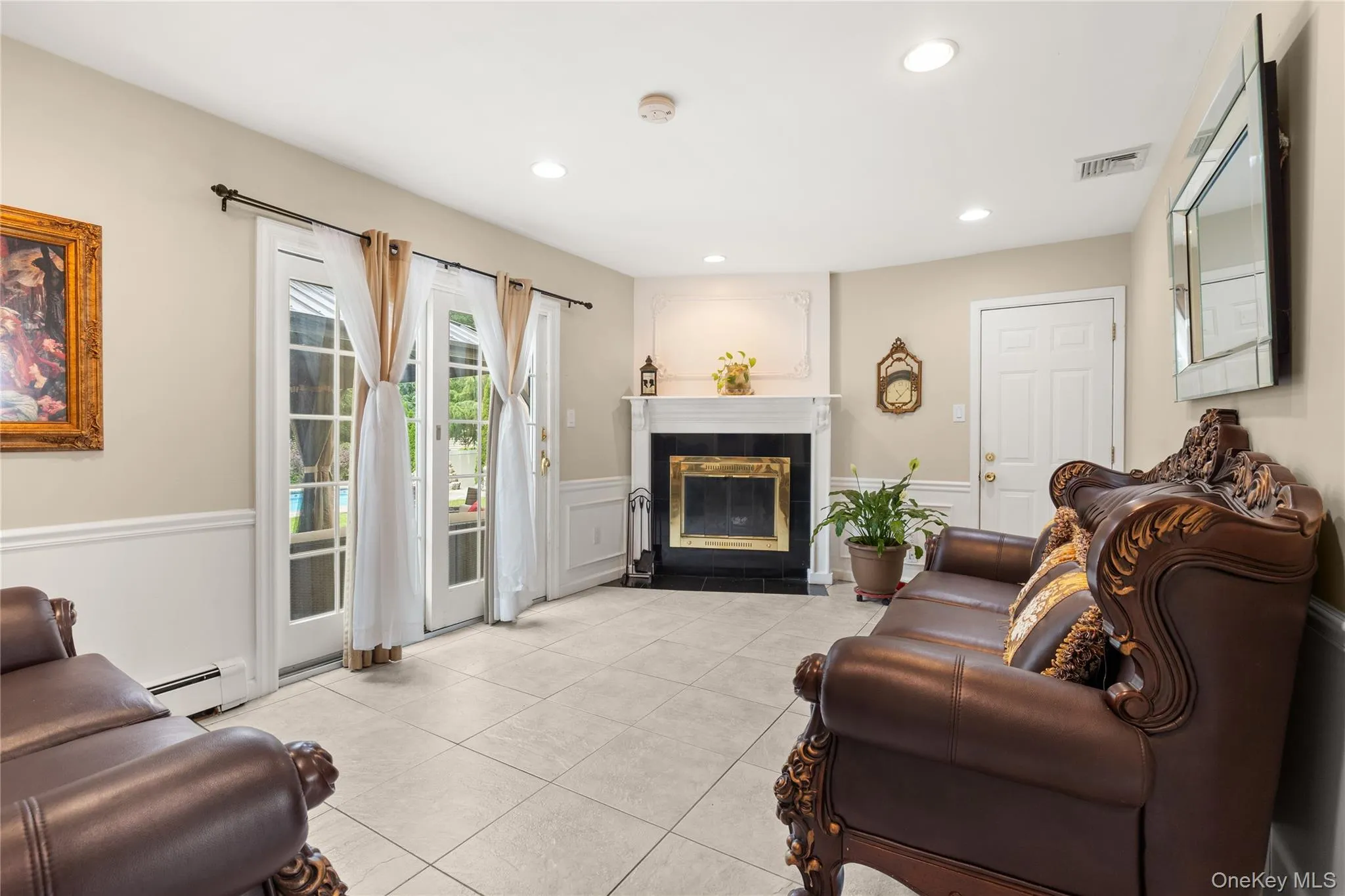 Family room featuring fireplace and sliding glass doors lead to your beautiful yard large Family room featuring fireplace and sliding glass doors lead to your beautiful yard large