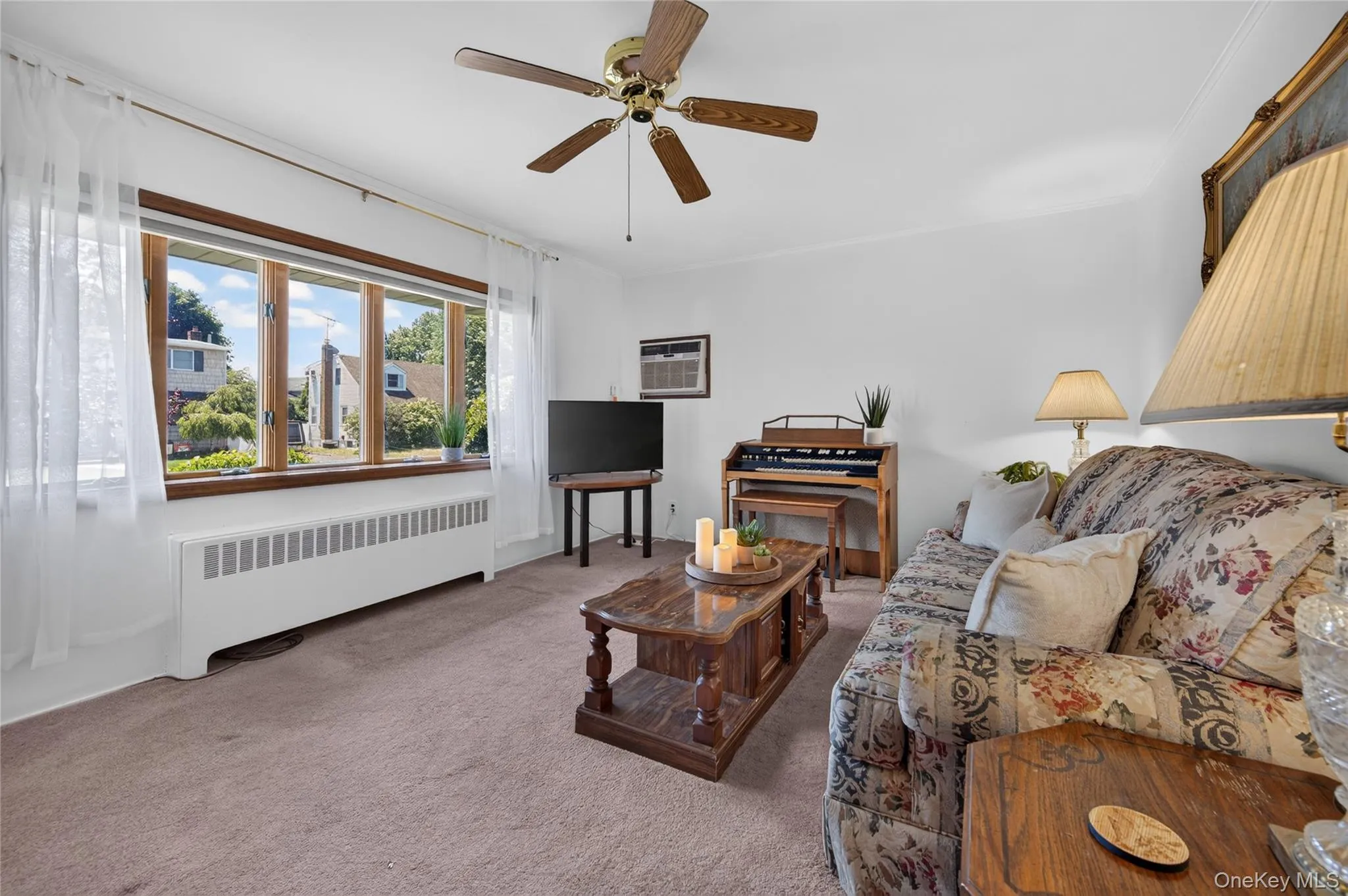 Living room with hardwood flooring under carpet Living room with hardwood flooring under carpet