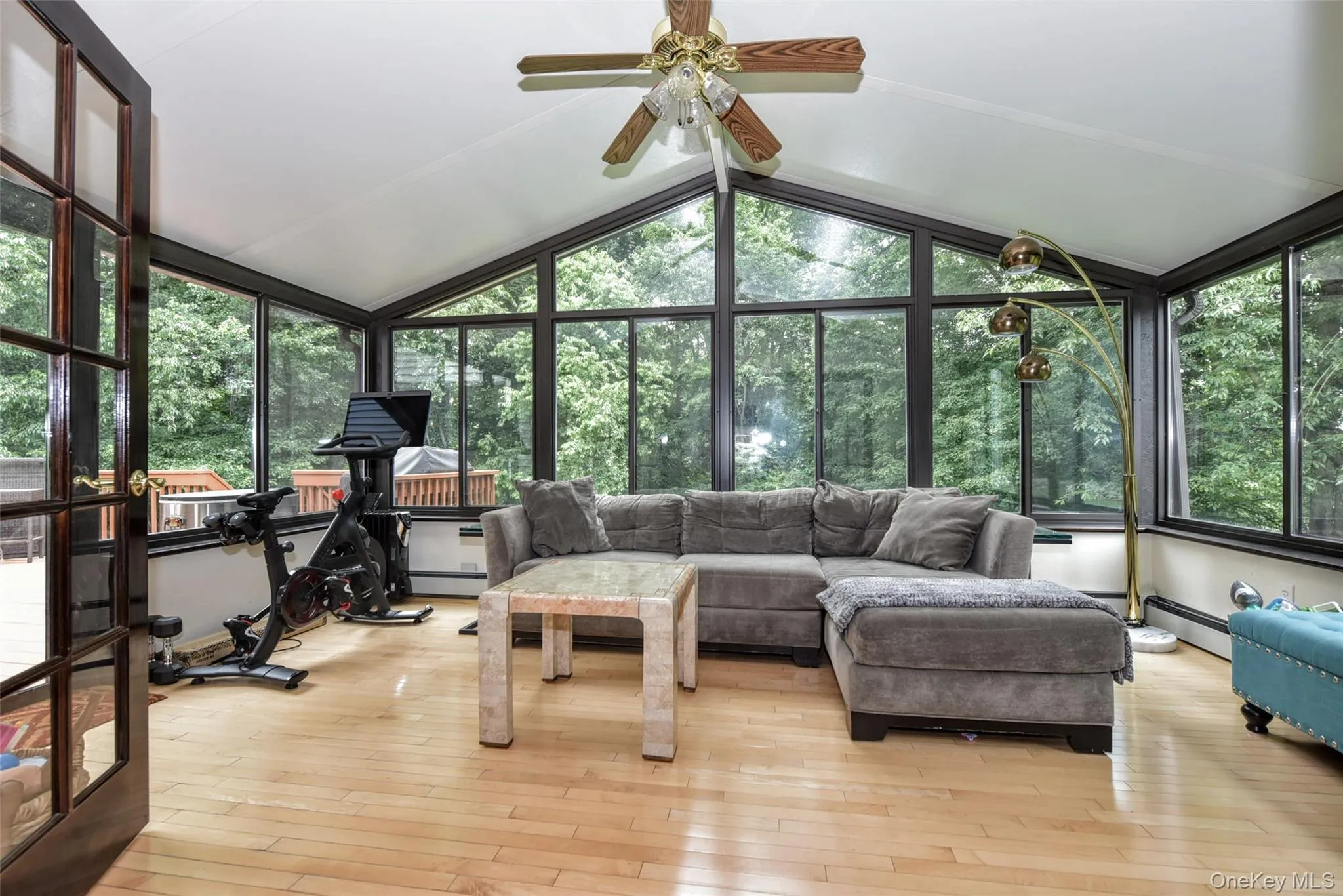 Sun room to enjoy private rear yard and nature. Sun room to enjoy private rear yard and nature.