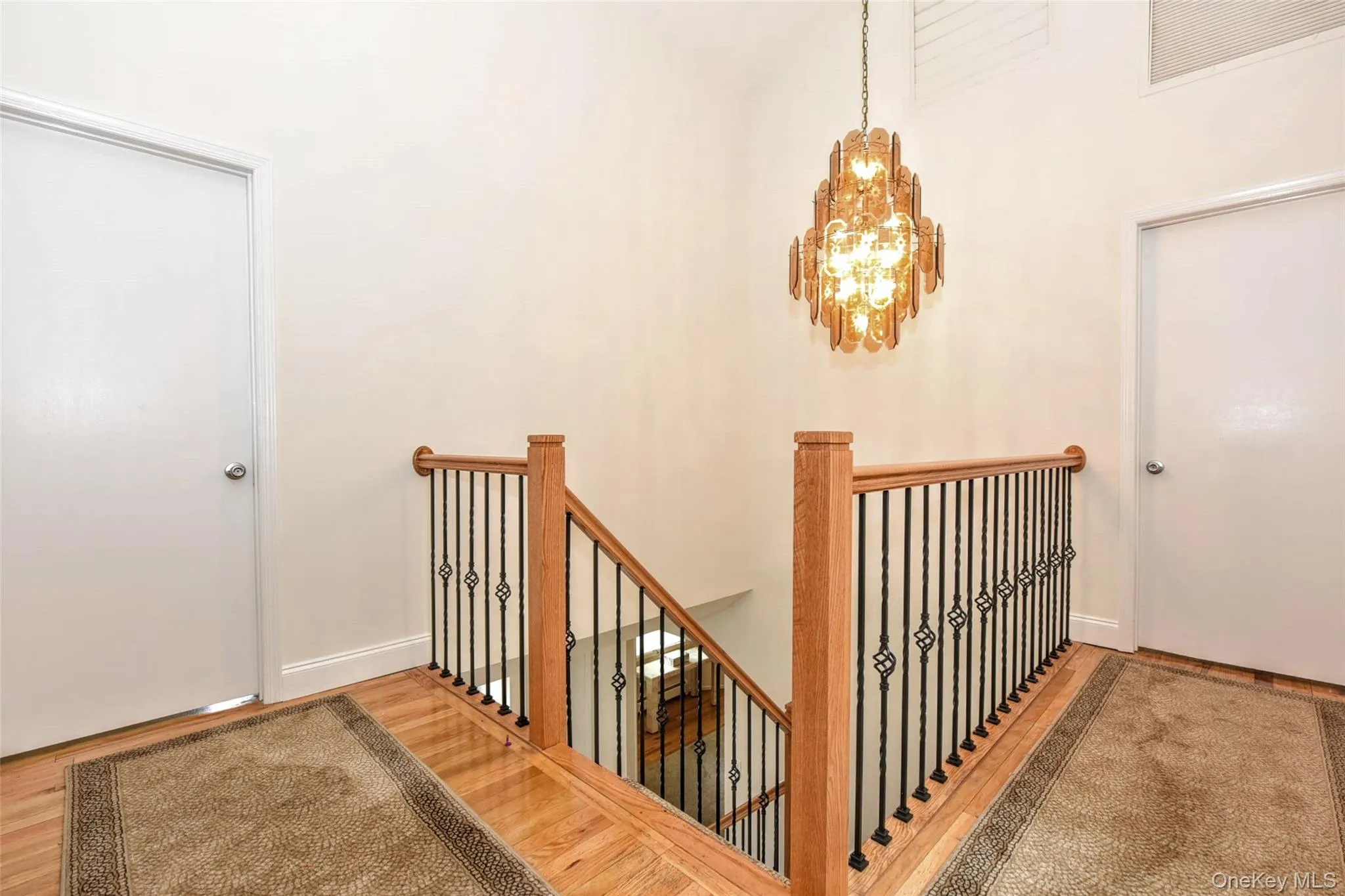Second floor landing with stylish new bannister. Second floor landing with stylish new bannister.