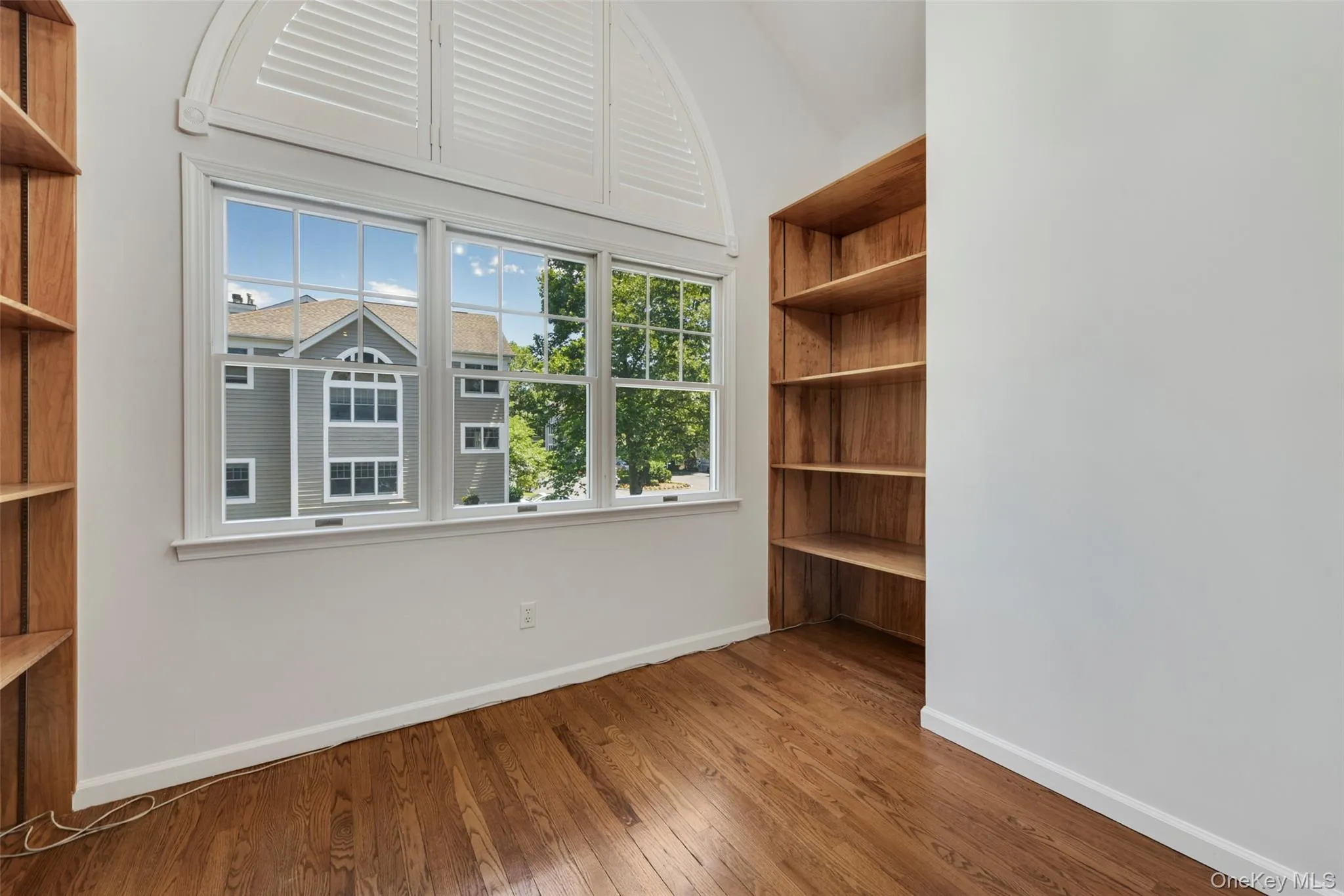 Convenient nook at top of stairs with built-in bookshelves. Perfect for a desk, window seat, etc. Convenient nook at top of stairs with built-in bookshelves. Perfect for a desk, window seat, etc.