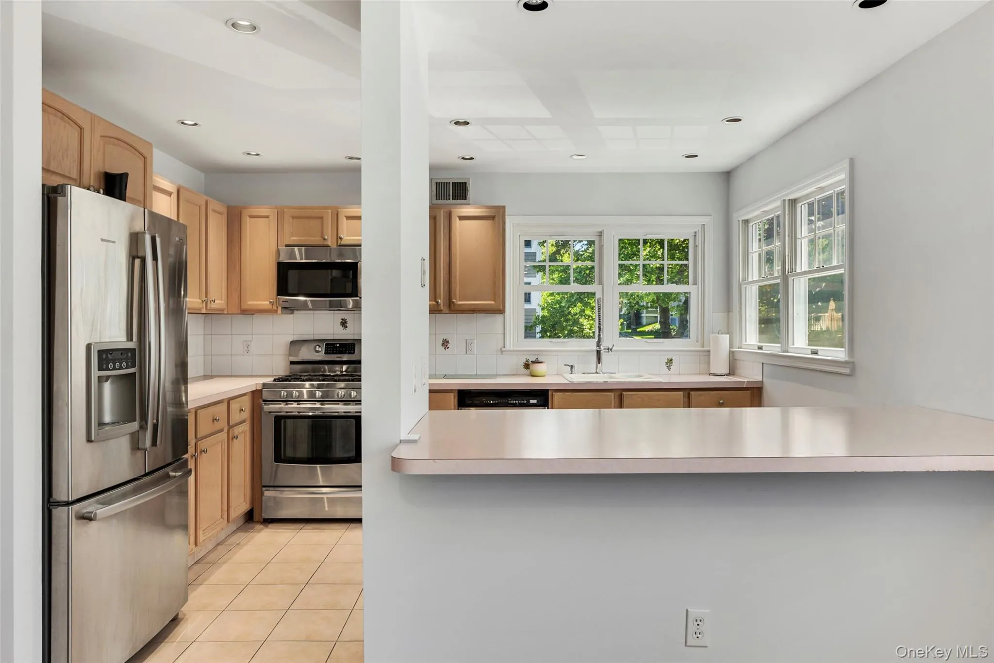 The kitchen features stainless steel appliances . The kitchen features stainless steel appliances .