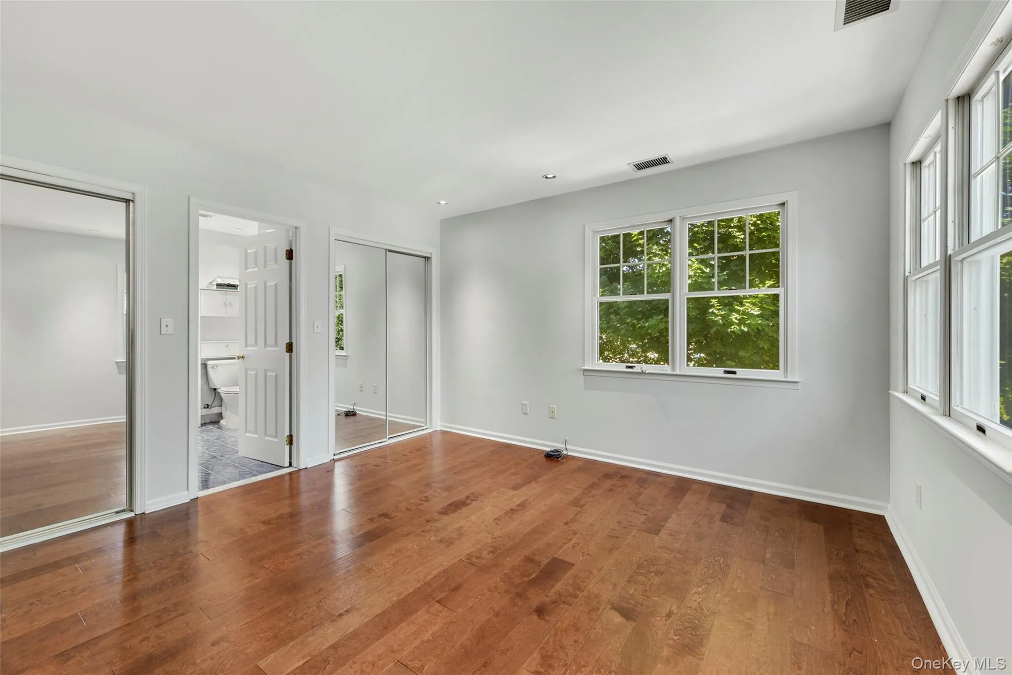 Primary bedroom with two closets and ensuite bathroom. Primary bedroom with two closets and ensuite bathroom.