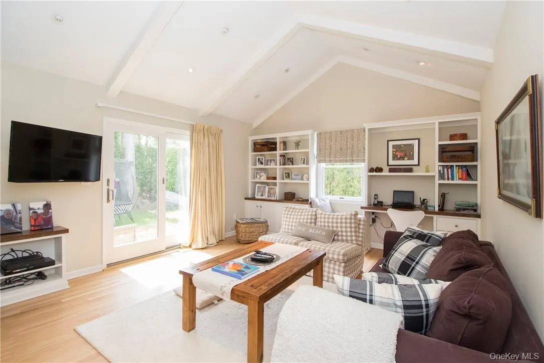 Family room with fireplace, doors to backyard and built-ins Family room with fireplace, doors to backyard and built-ins