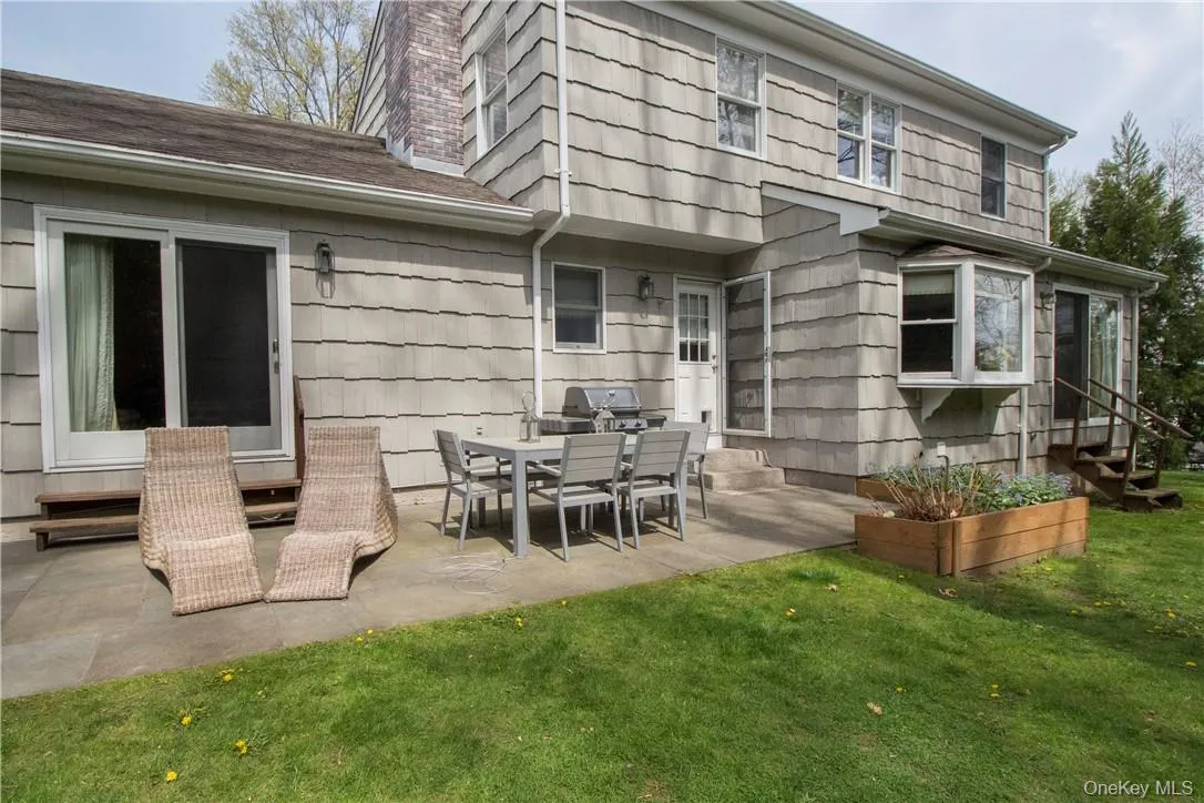 Backyard patio with access from family room and kitchen Backyard patio with access from family room and kitchen