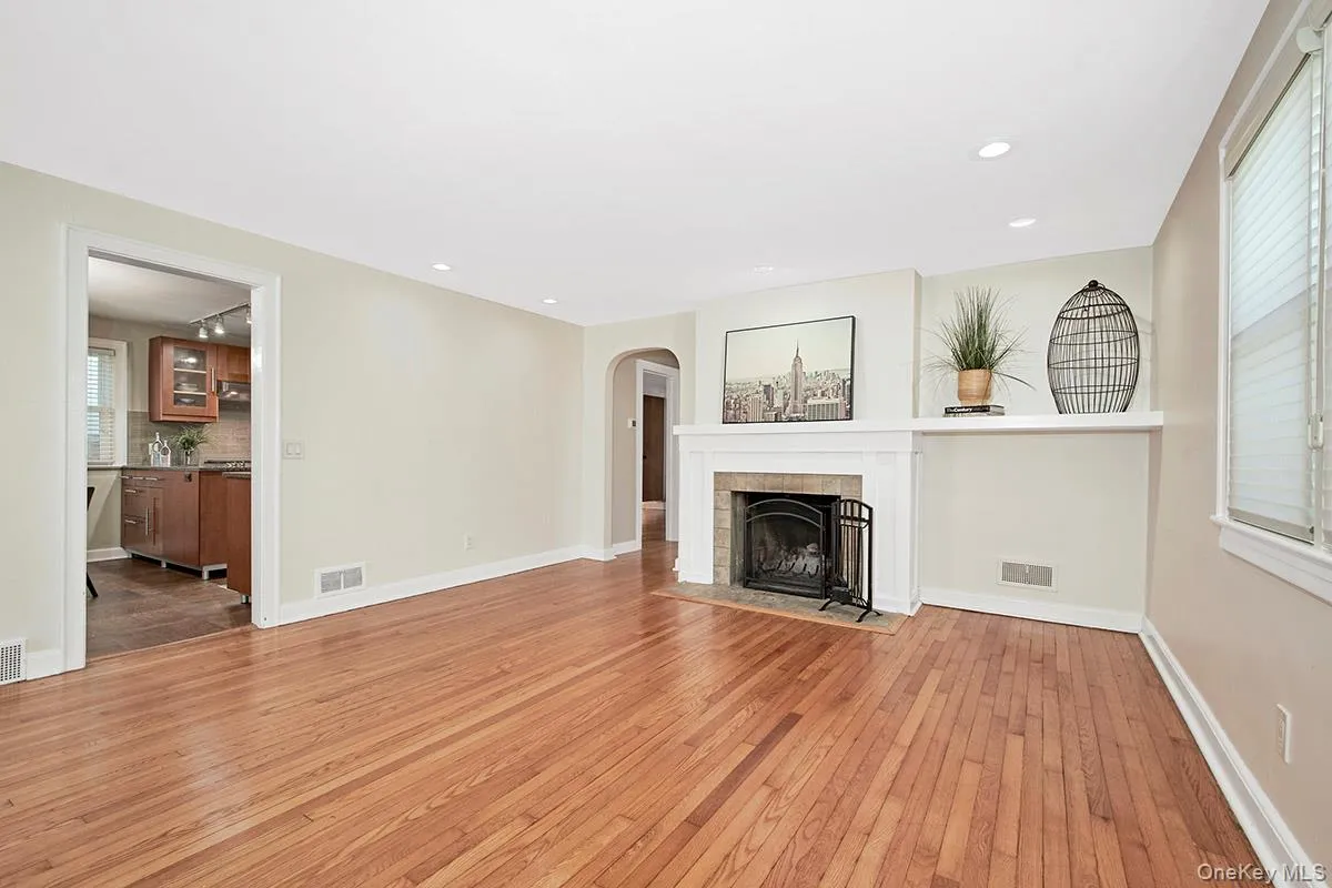 Living room with opening to kitchen and hallway Living room with opening to kitchen and hallway