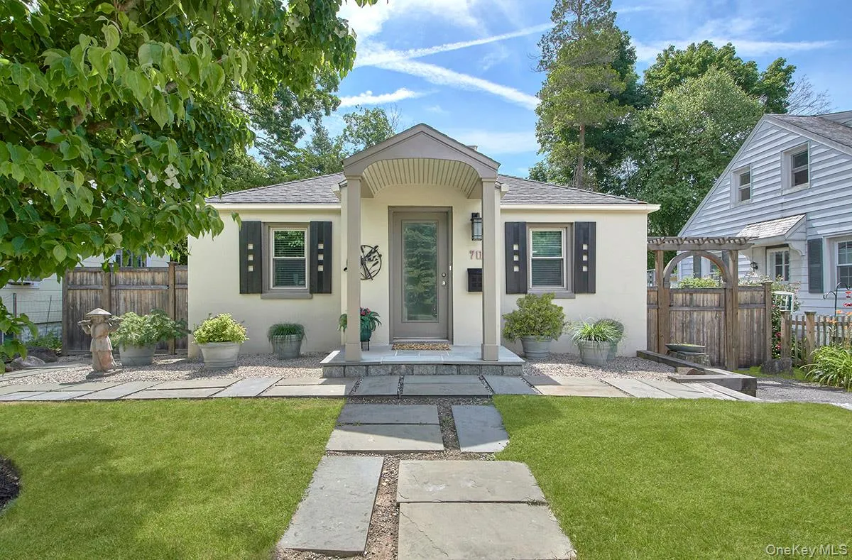 Front of house with gate and Pagoda to fenced in back yard Front of house with gate and Pagoda to fenced in back yard