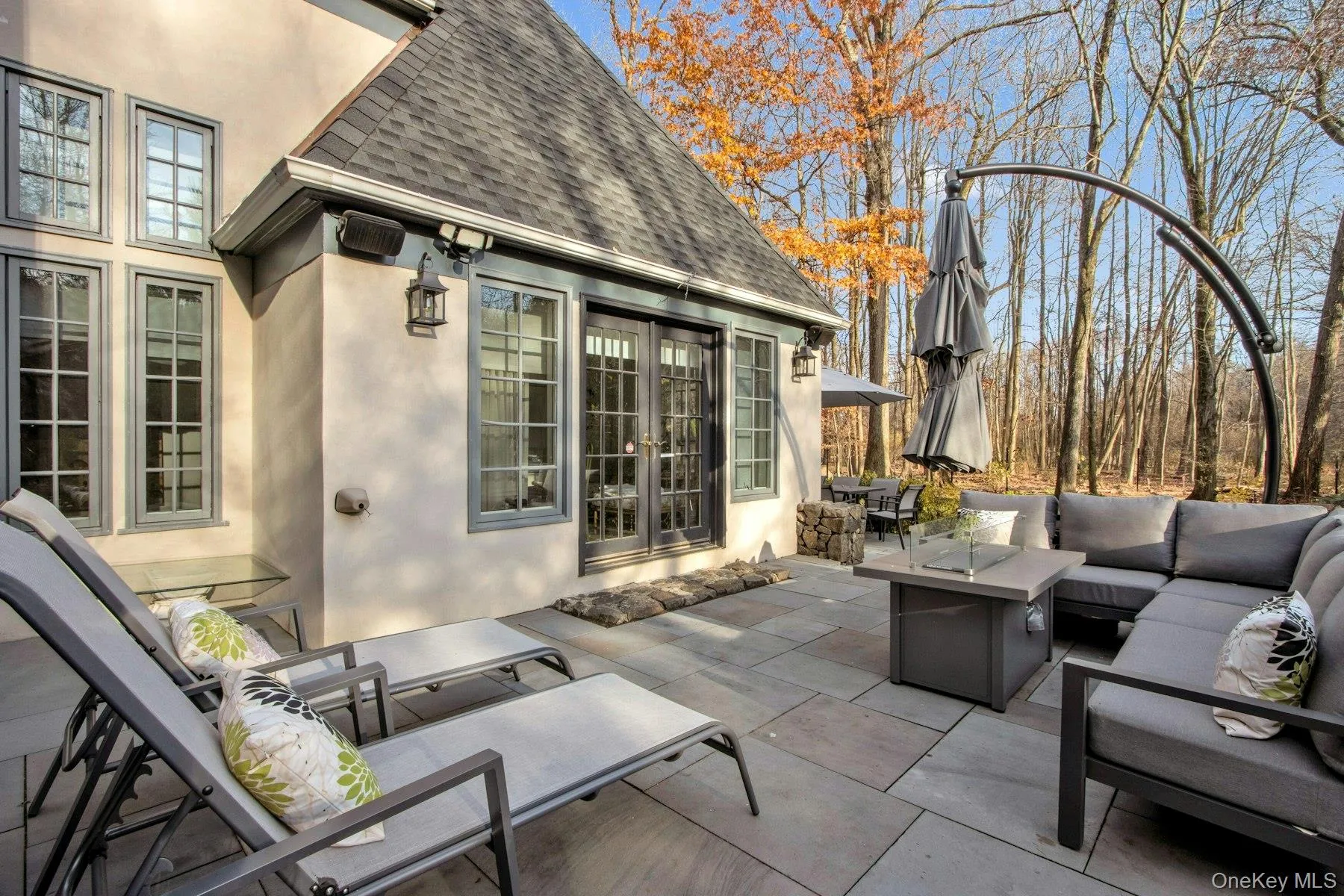 View of patio / terrace with an outdoor living space with a fire pit View of patio / terrace with an outdoor living space with a fire pit