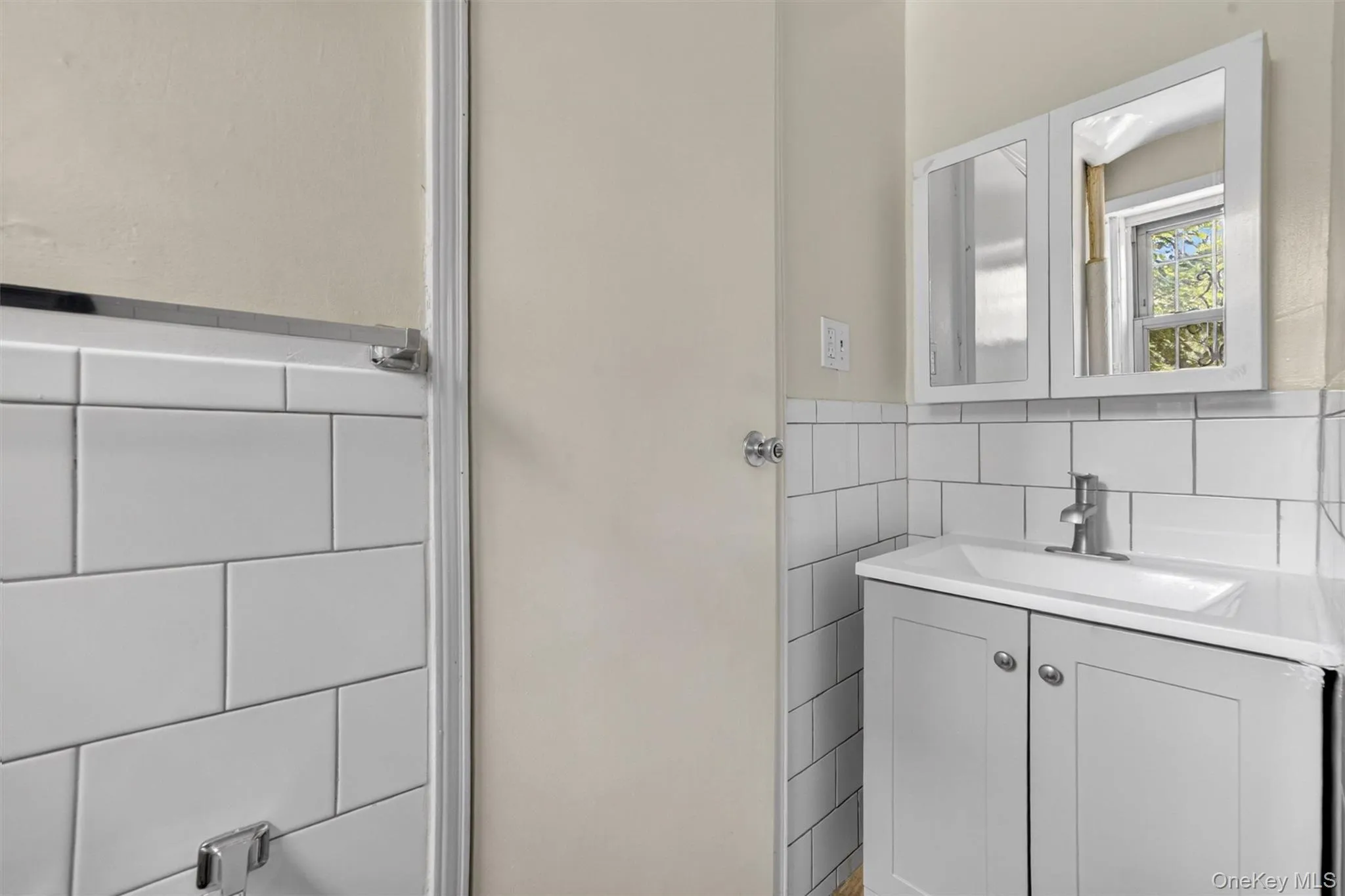 Bathroom has updated fixtures and tiling Bathroom has updated fixtures and tiling