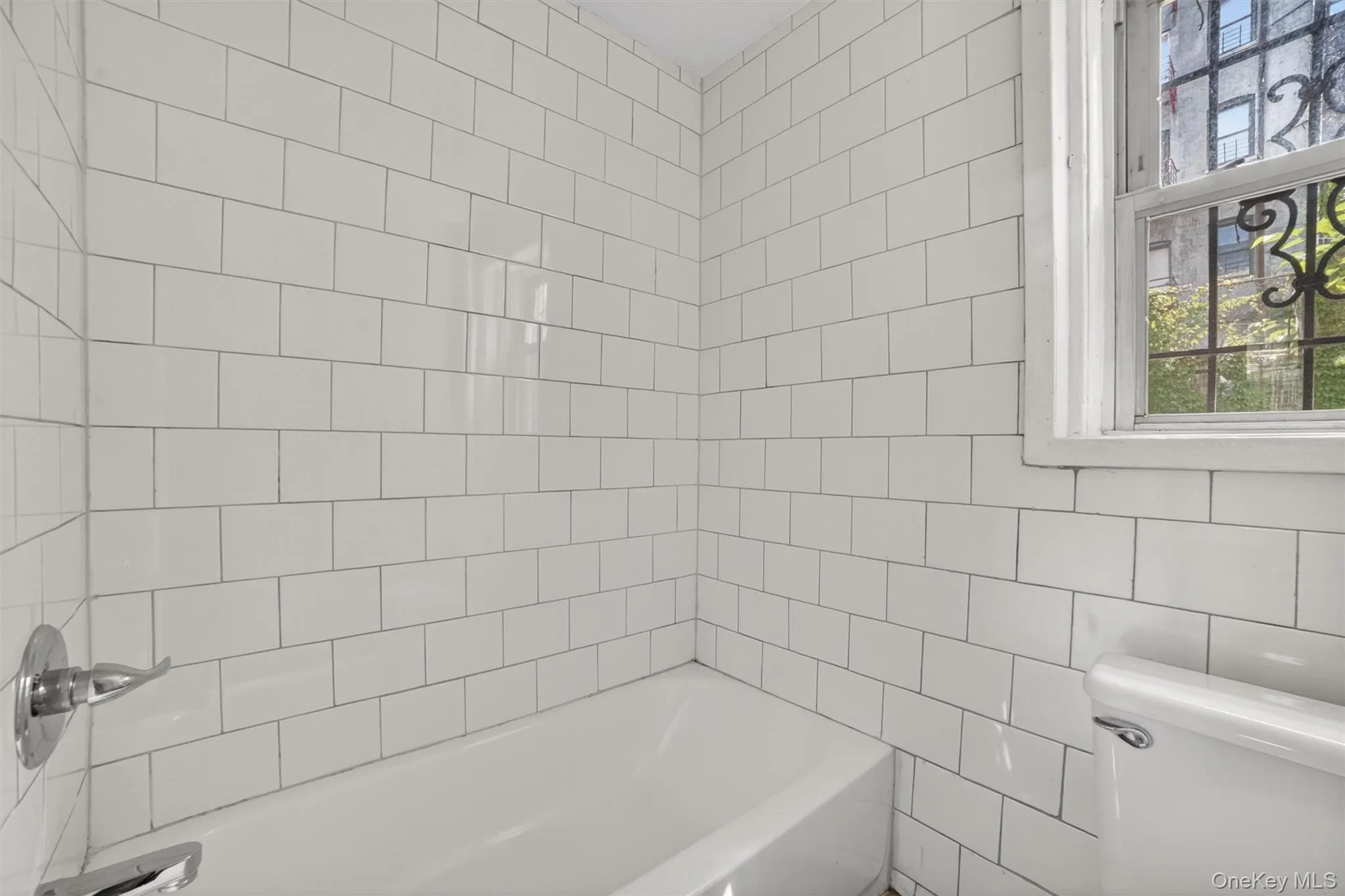 Bathroom has updated fixtures and tiles Bathroom has updated fixtures and tiles