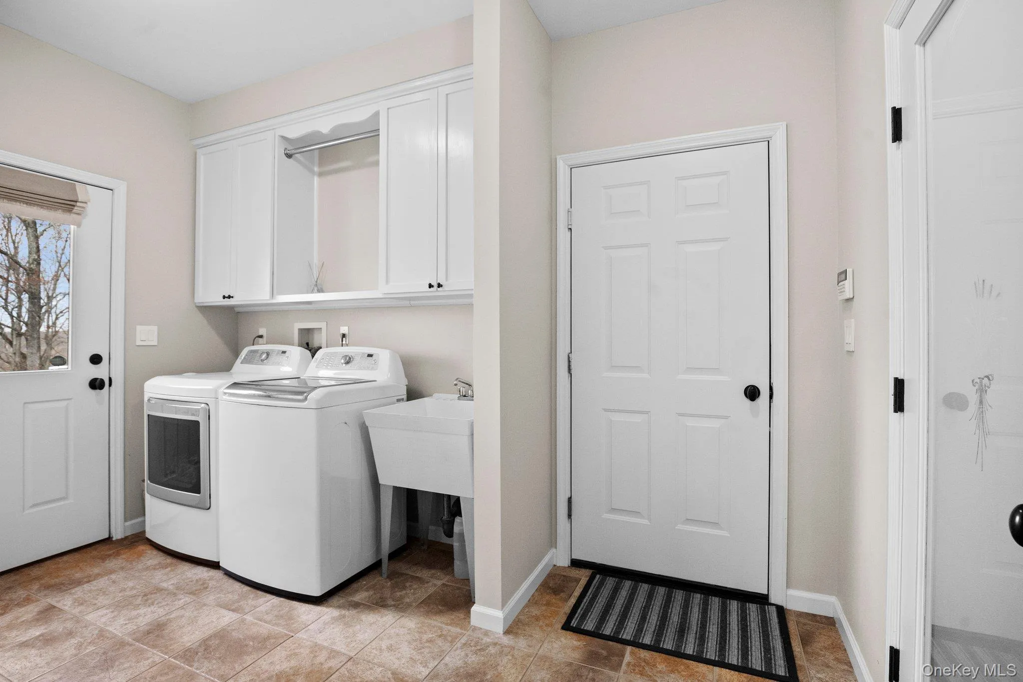 Laundry room off of kitchen Laundry room off of kitchen