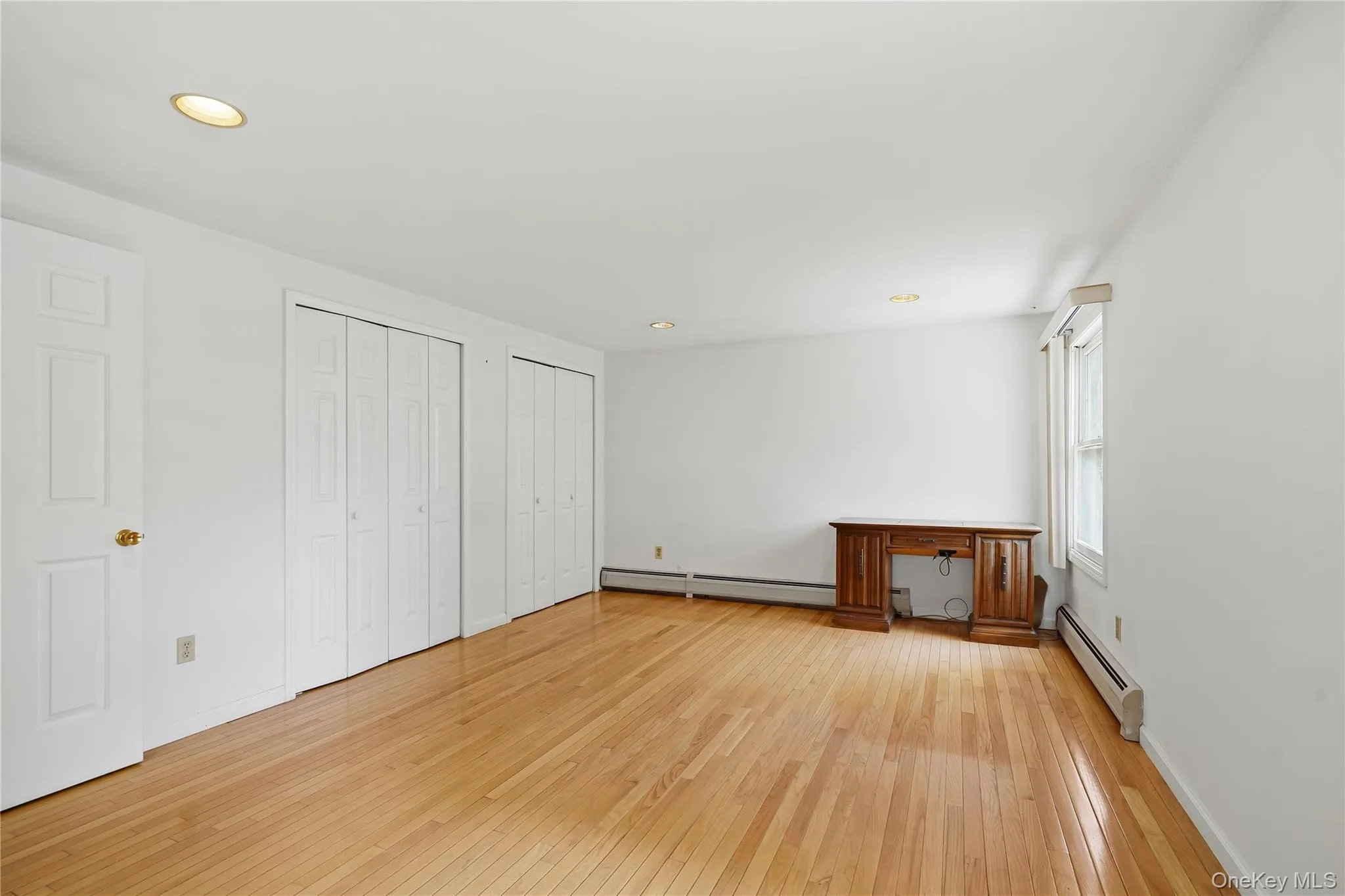 Primary Bedroom - beautifully maintained hardwood Primary Bedroom - beautifully maintained hardwood