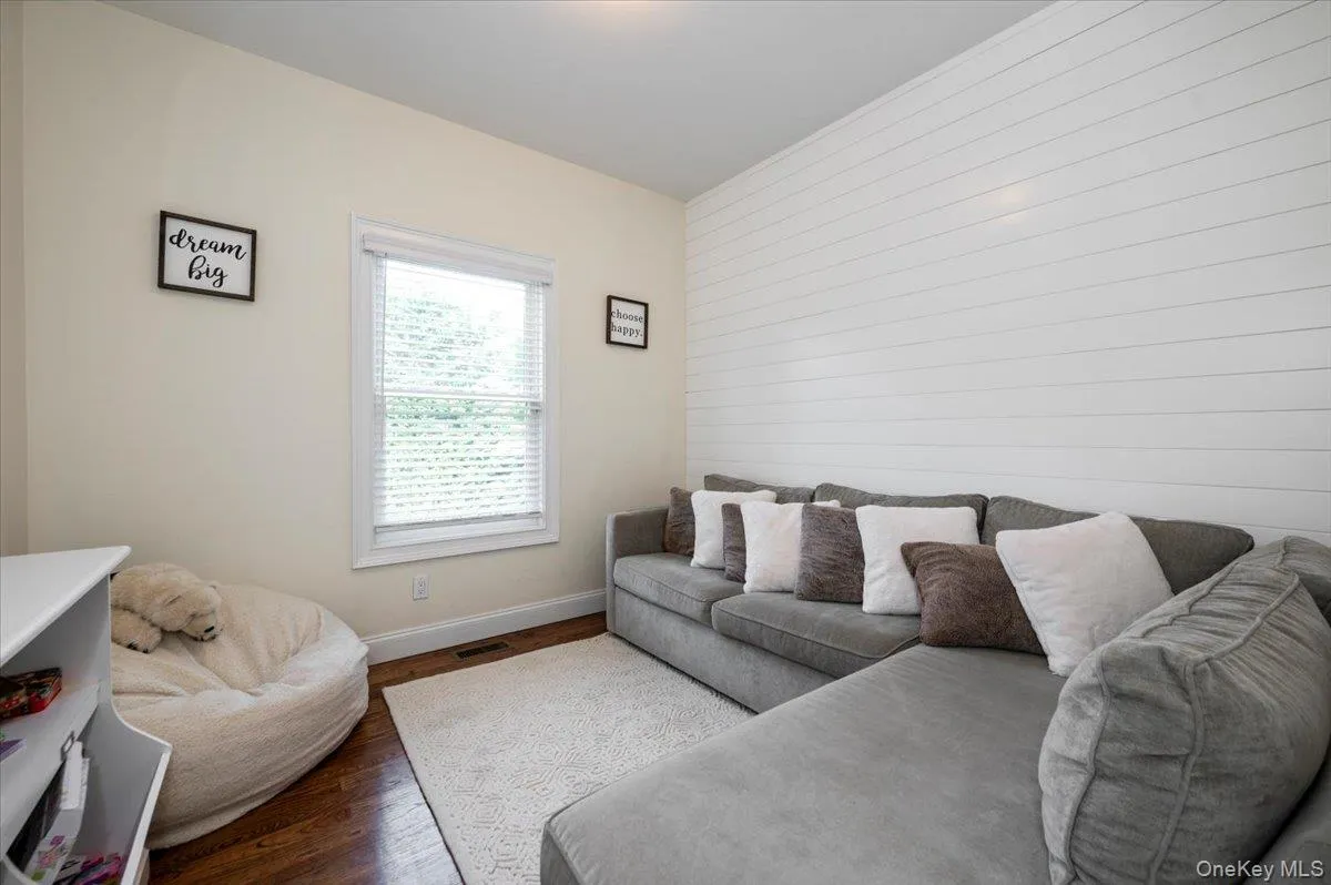 Accent wall featuring horizontal shiplap paneling Accent wall featuring horizontal shiplap paneling