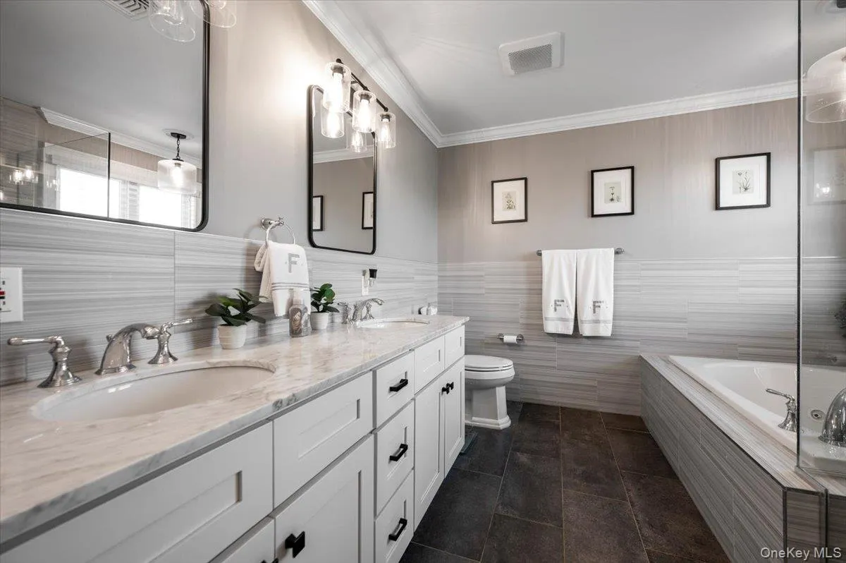 Dual vanity with stone countertop and undermount sinks Dual vanity with stone countertop and undermount sinks