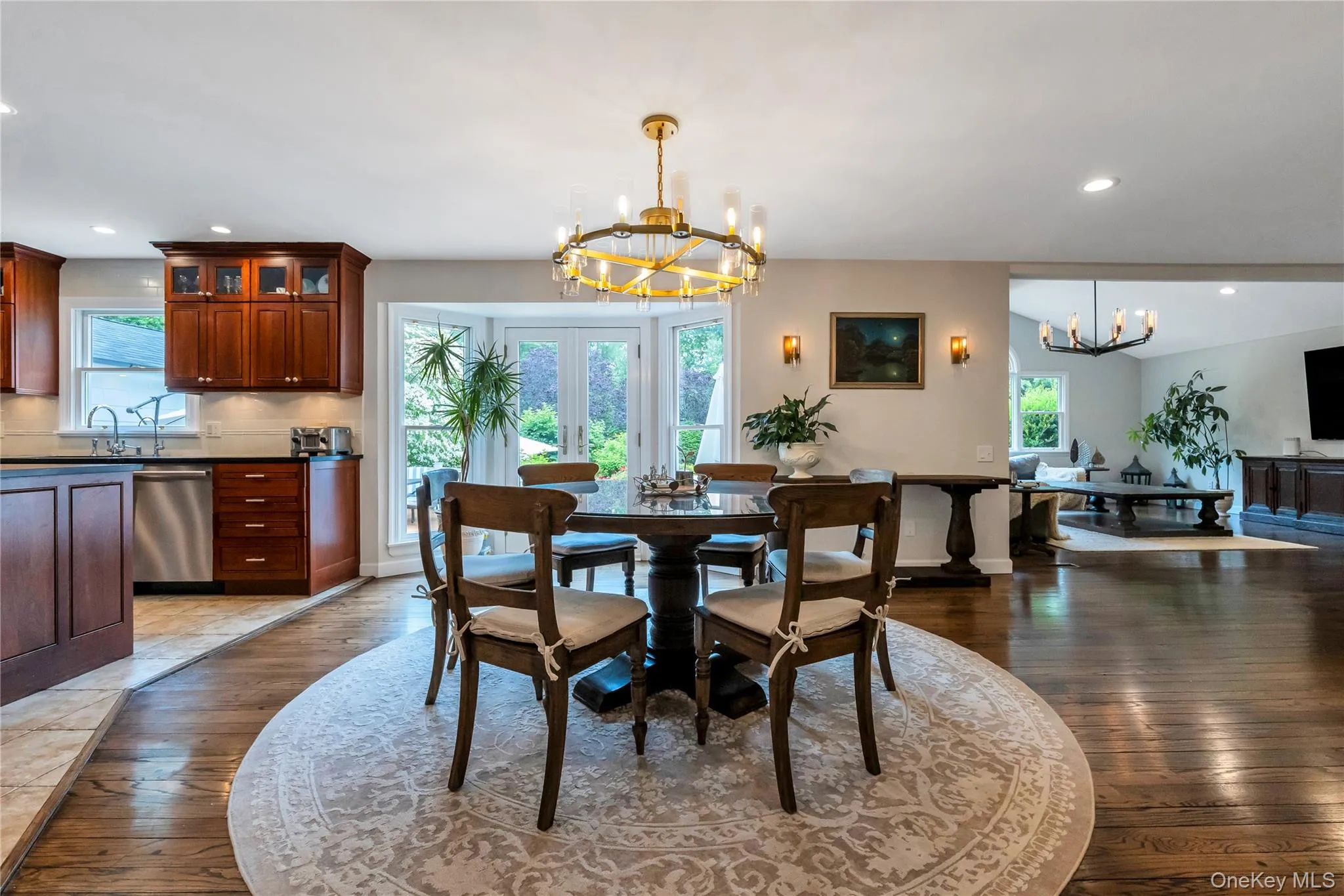 Dining room featuring a chandelier, wood-type flooring, and recessed lighting Dining room featuring a chandelier, wood-type flooring, and recessed lighting